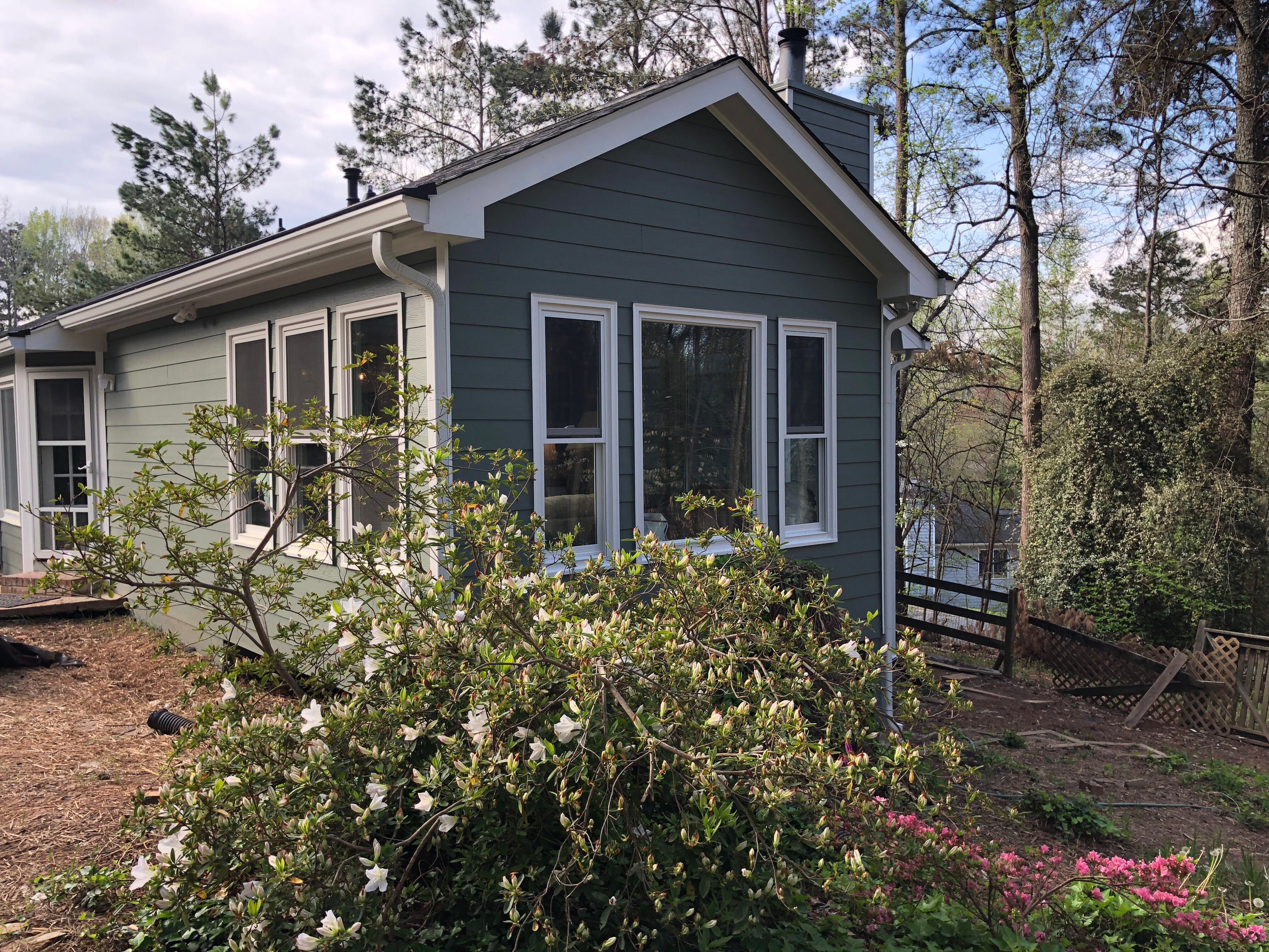 Elevated Sunroom Addition Featuring Dark Gray Siding in Kennesaw by Swift Home Renovations