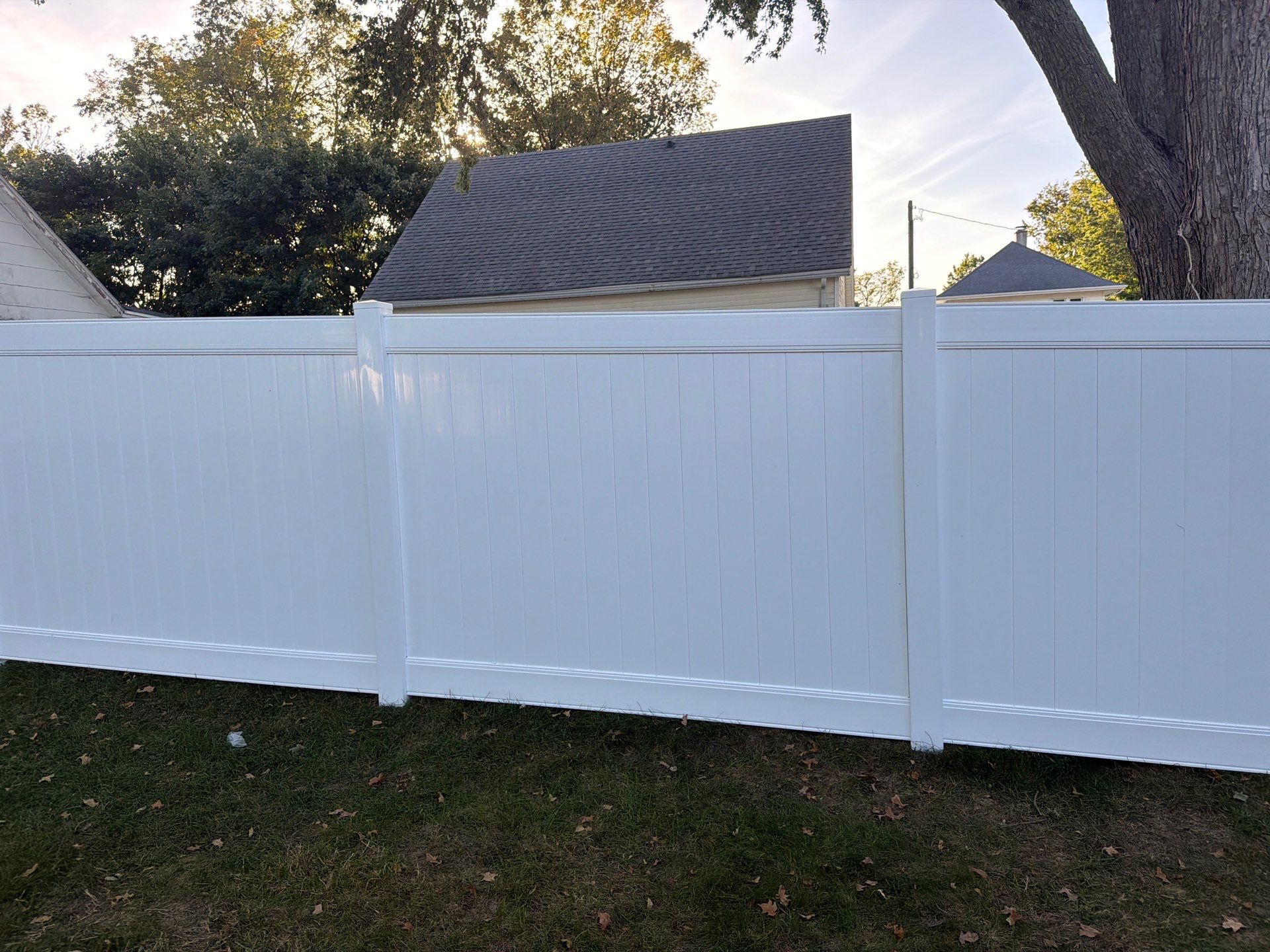 White Vinyl Privacy Fence and Gate Installation in Grundy Center by Perfect Picket Fence and Stain