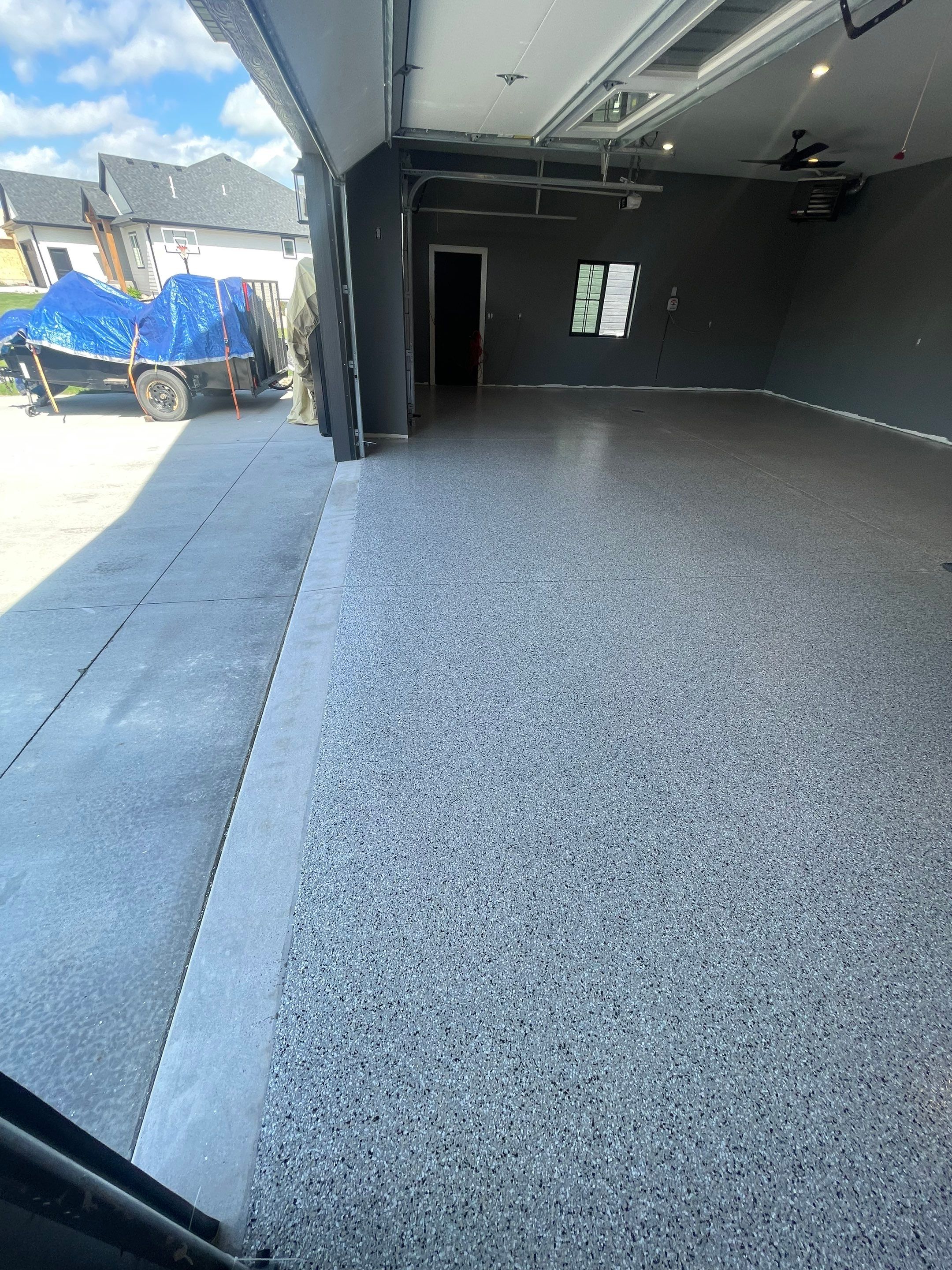 Custom Speckled Concrete Coating for Dell Rapids Garage by Select Painting, Coatings & Garage Cabinets