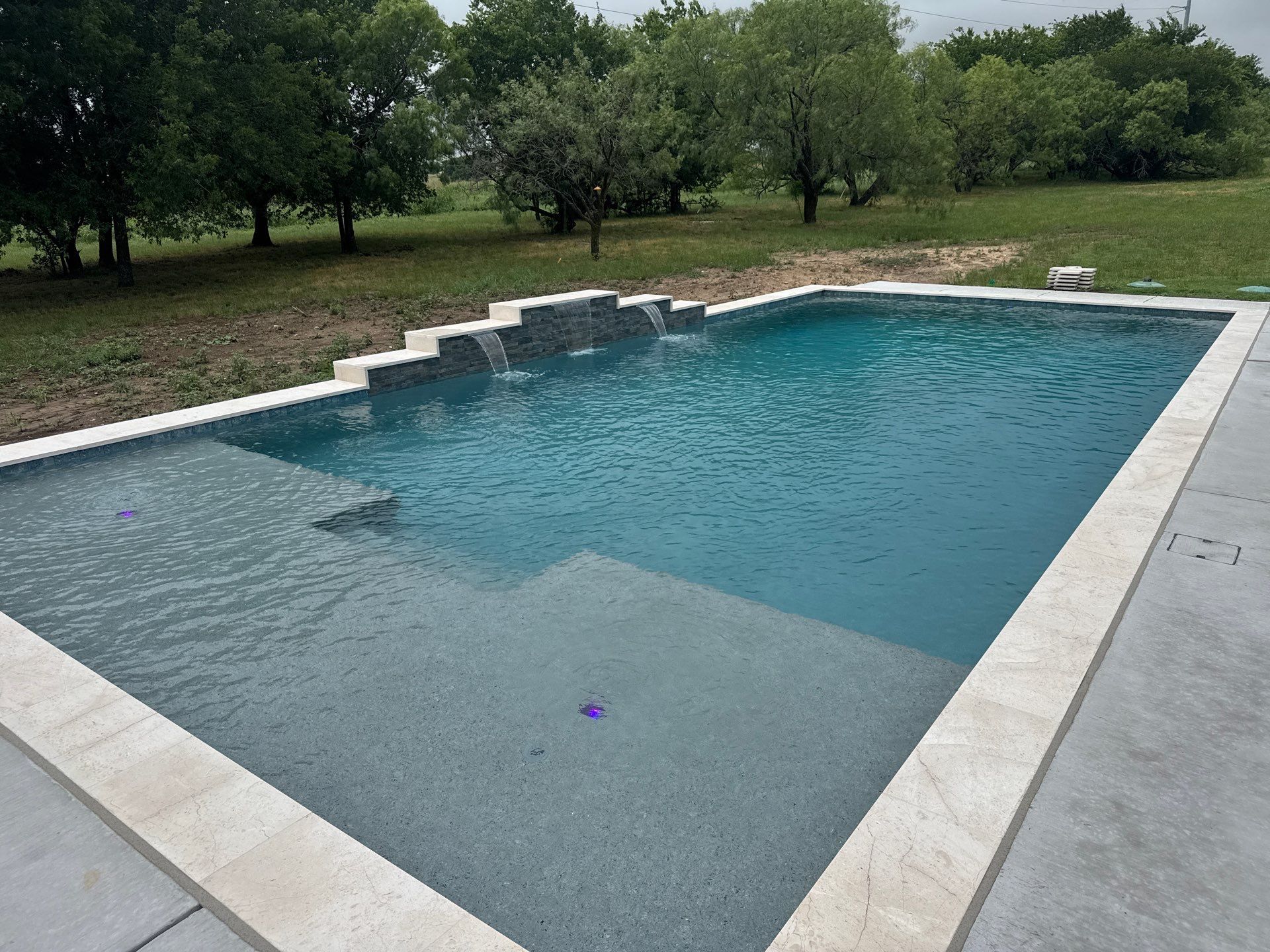 Expansive Geometric Pool with Countryside Views by Pinnacle Pools and Spas - DFW