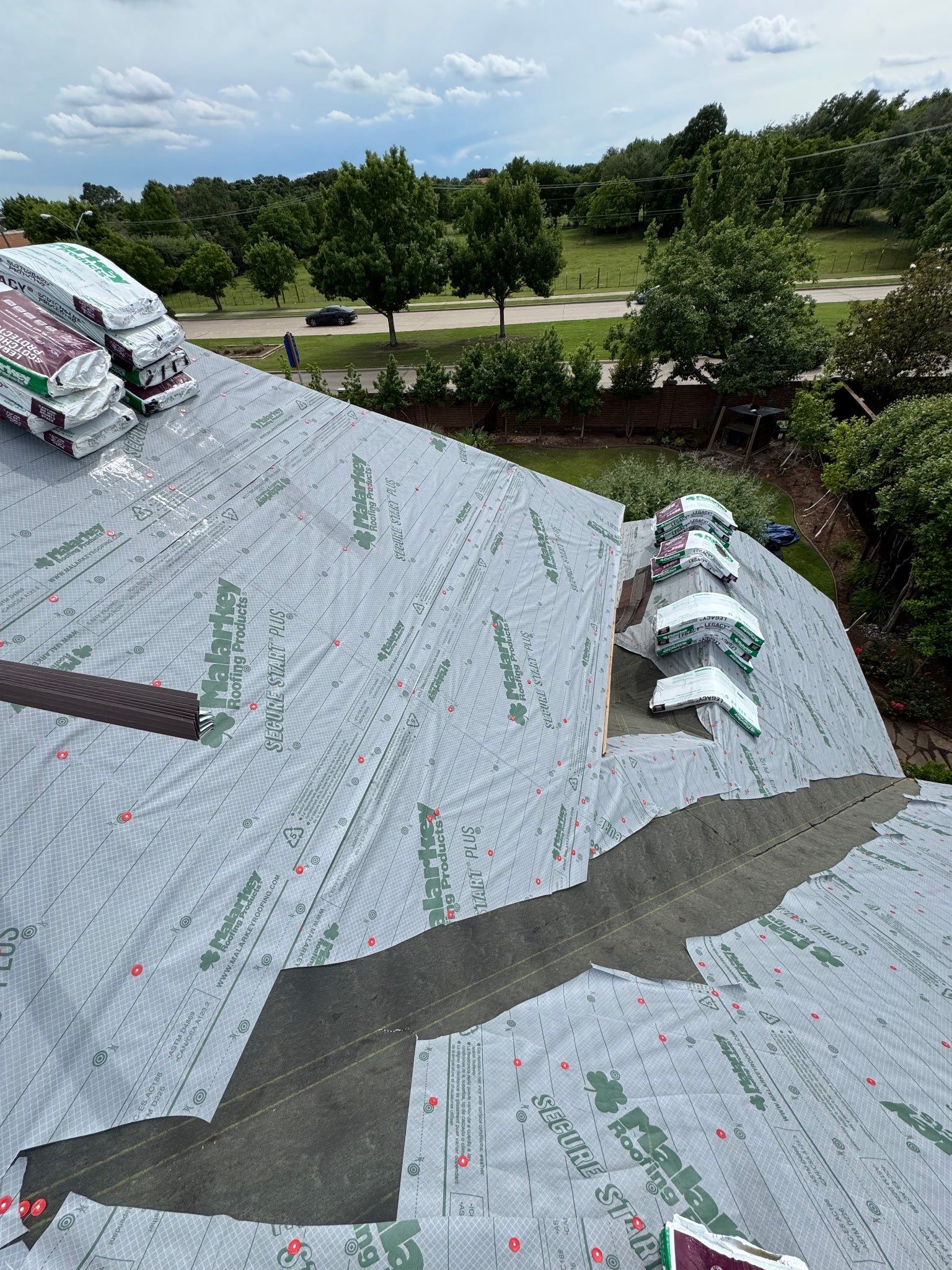 Residential Roofing Installation using Malarkey Legacy Scotchgard Shingles by Harvey Roofing & Construction