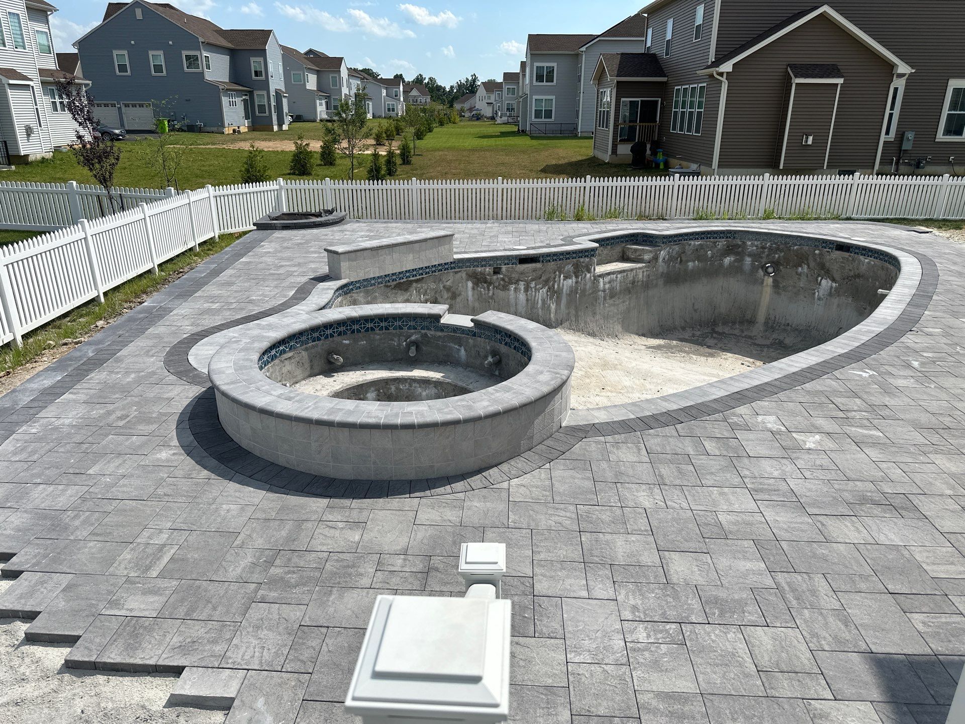 Pool and Hardscape Design in Delaware | Belgard Paver Patio & Outdoor Living Space by Studio G Indoor Spaces & Outdoor Living