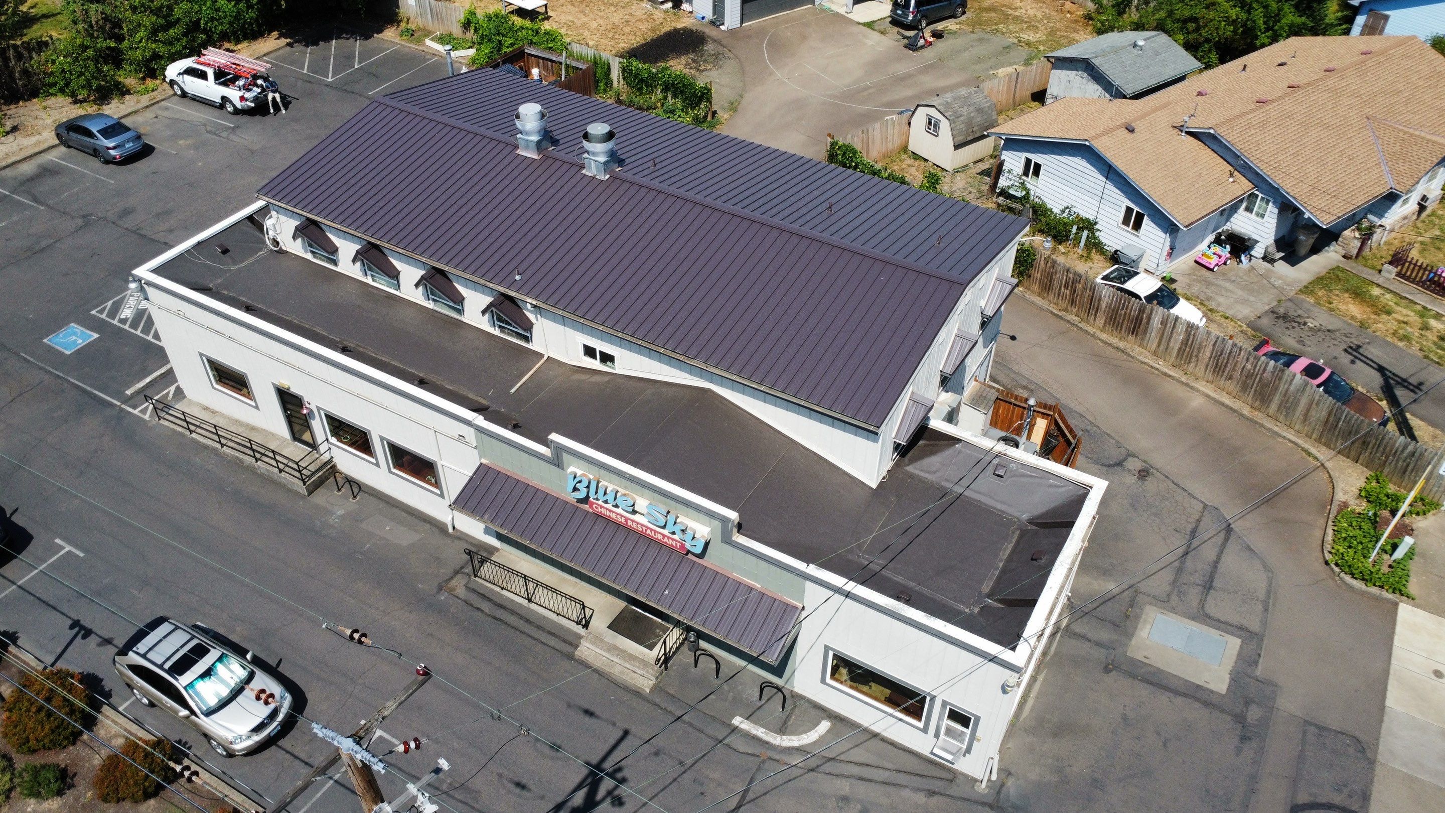 Commercial Flat Roof Installation using Bruce and Dana Snap Lock Metal (Color: Brown) by Orezona Building & Roofing Company, Inc.