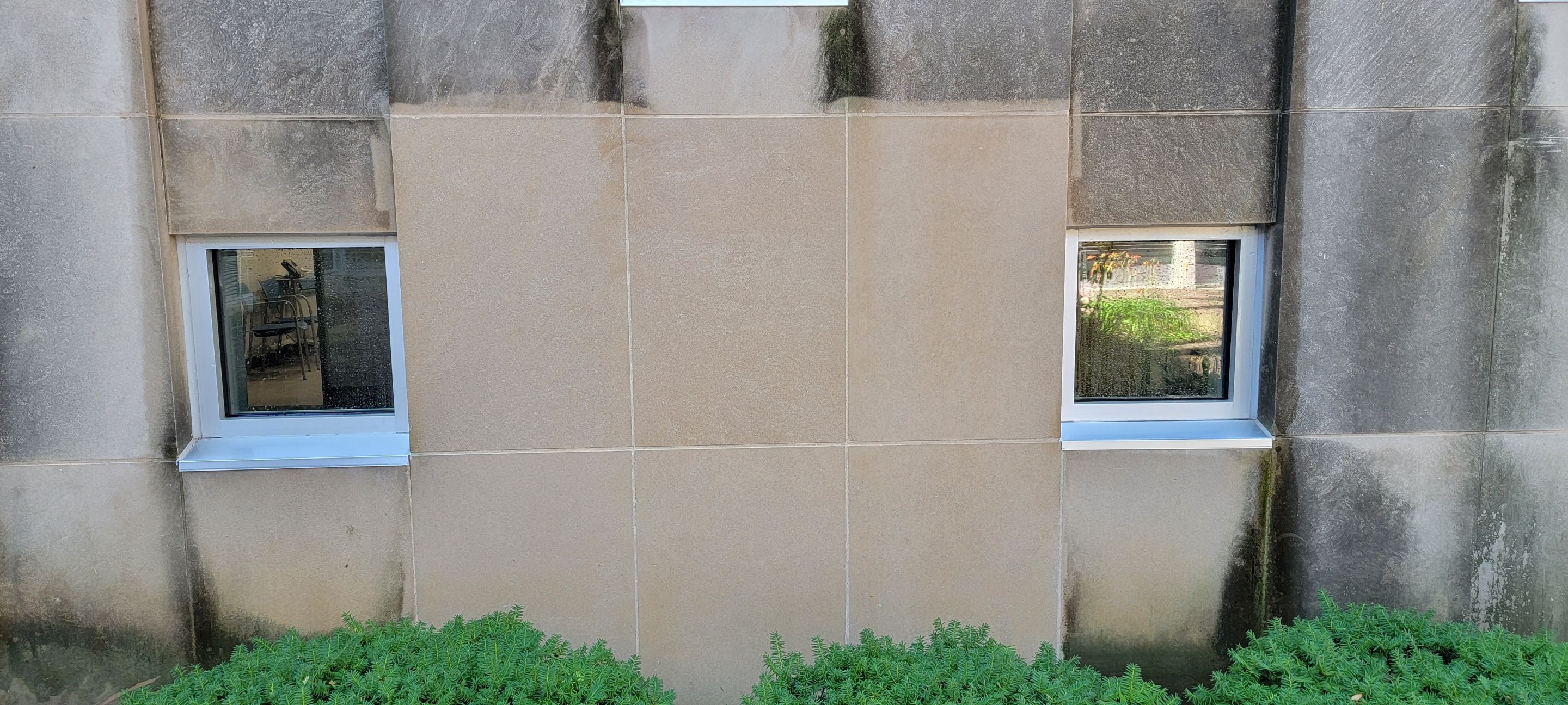 Courtyard pressure washing difficult access.  by Northern Power Washing LLC.