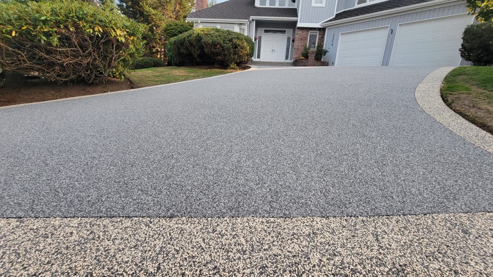 Elegant Driveway and Patio in Palazzo Vuba Stone by Concrete Coating Experts Inc.