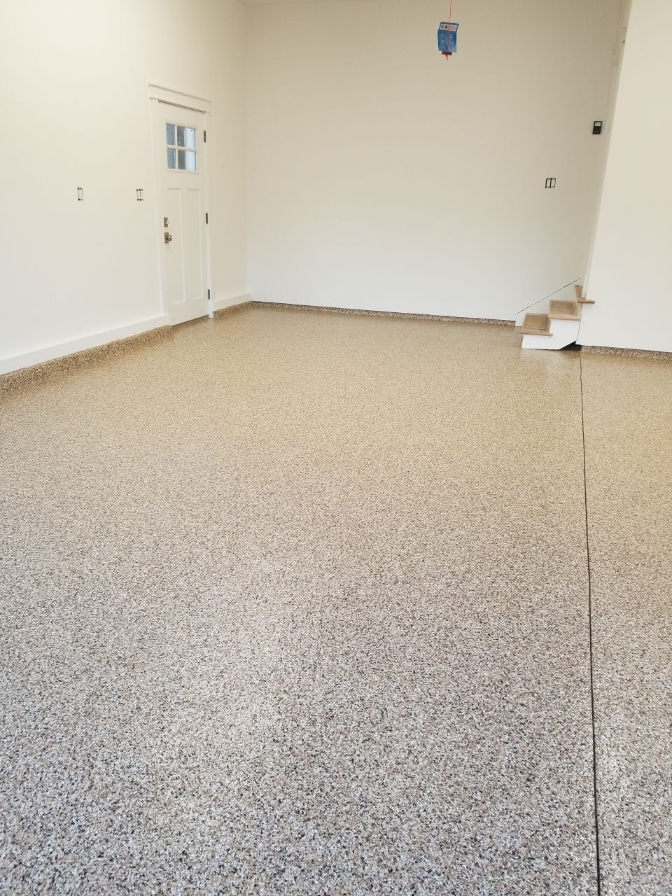 Garage Floor in Sandstone by Spectrum Painting, LLC
