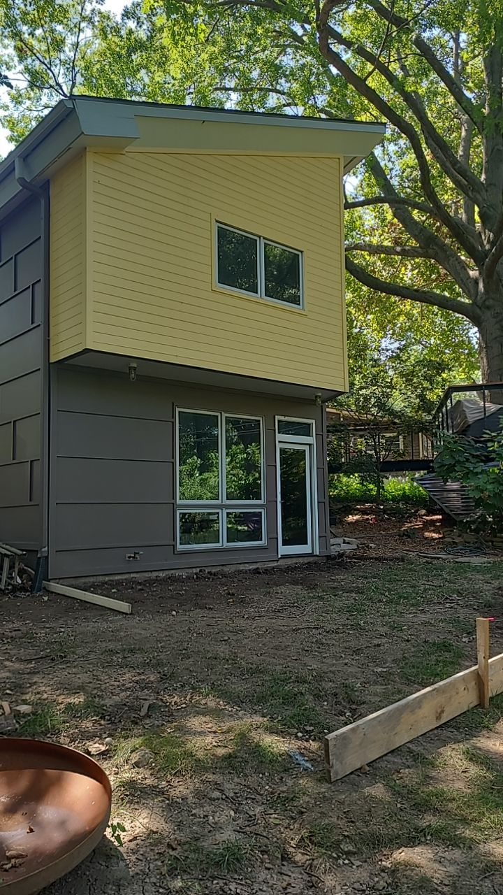 Back Yard Cantilivered Patio by LAND ESCAPES LLC