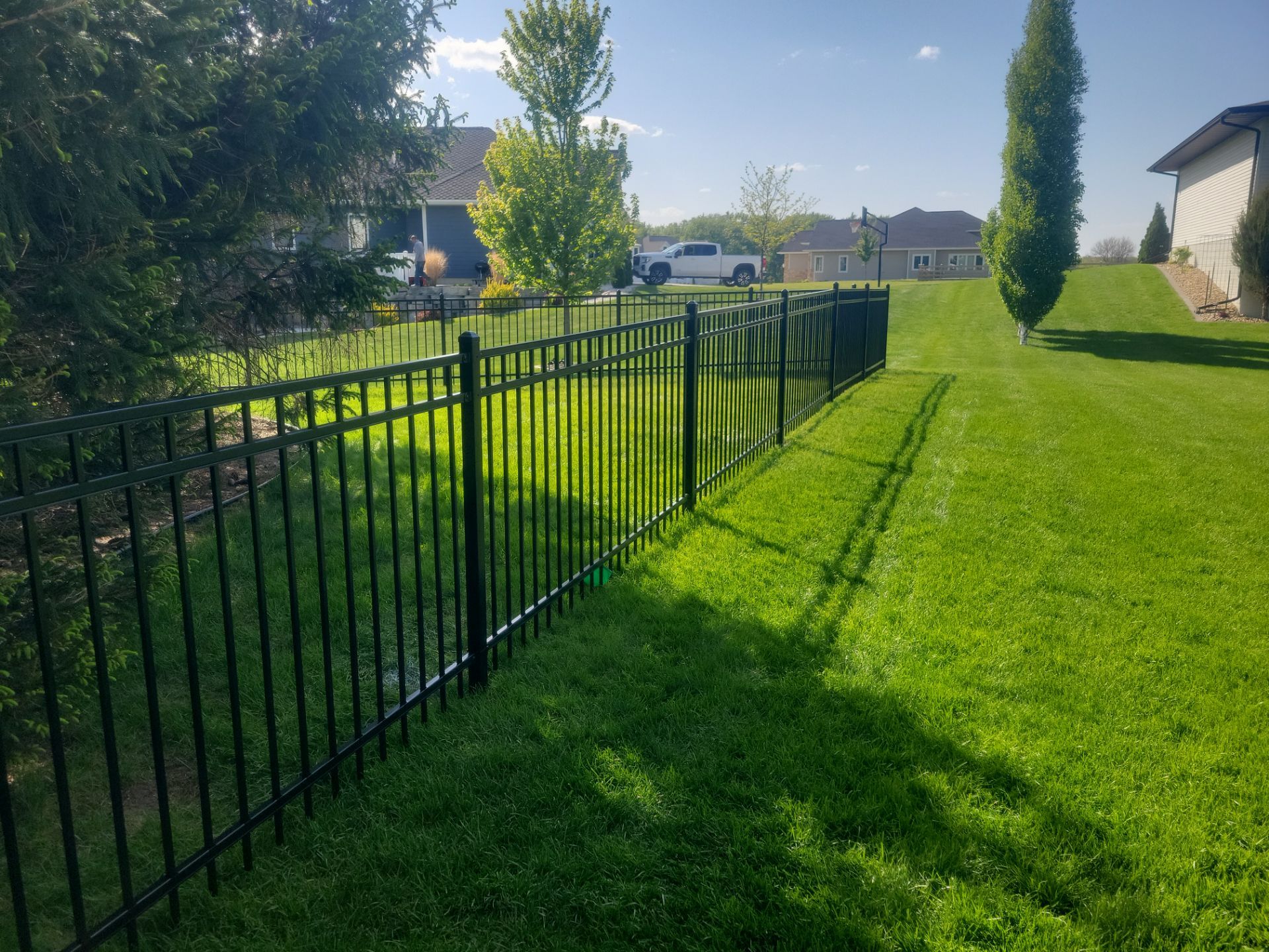 Black Ornamental Metal Picket Fence Installation in Waterloo by Perfect Picket Fence and Stain