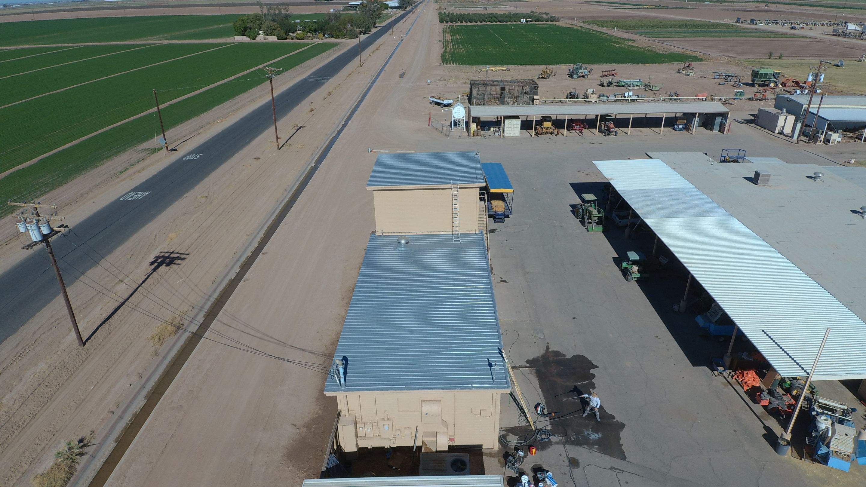 Metal roof restoration on commercial roof using Conklin Benchmark/PUMA XL fabric and coating by Straight Edge Roofing Inc
