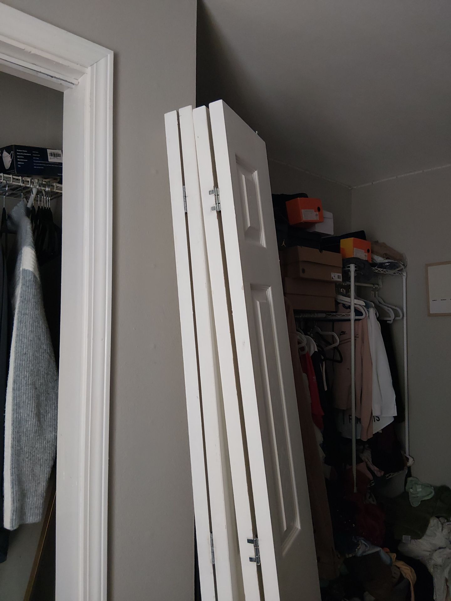 White Paneled Bifold Closet Door Installation by Legendary Services Company LLC.