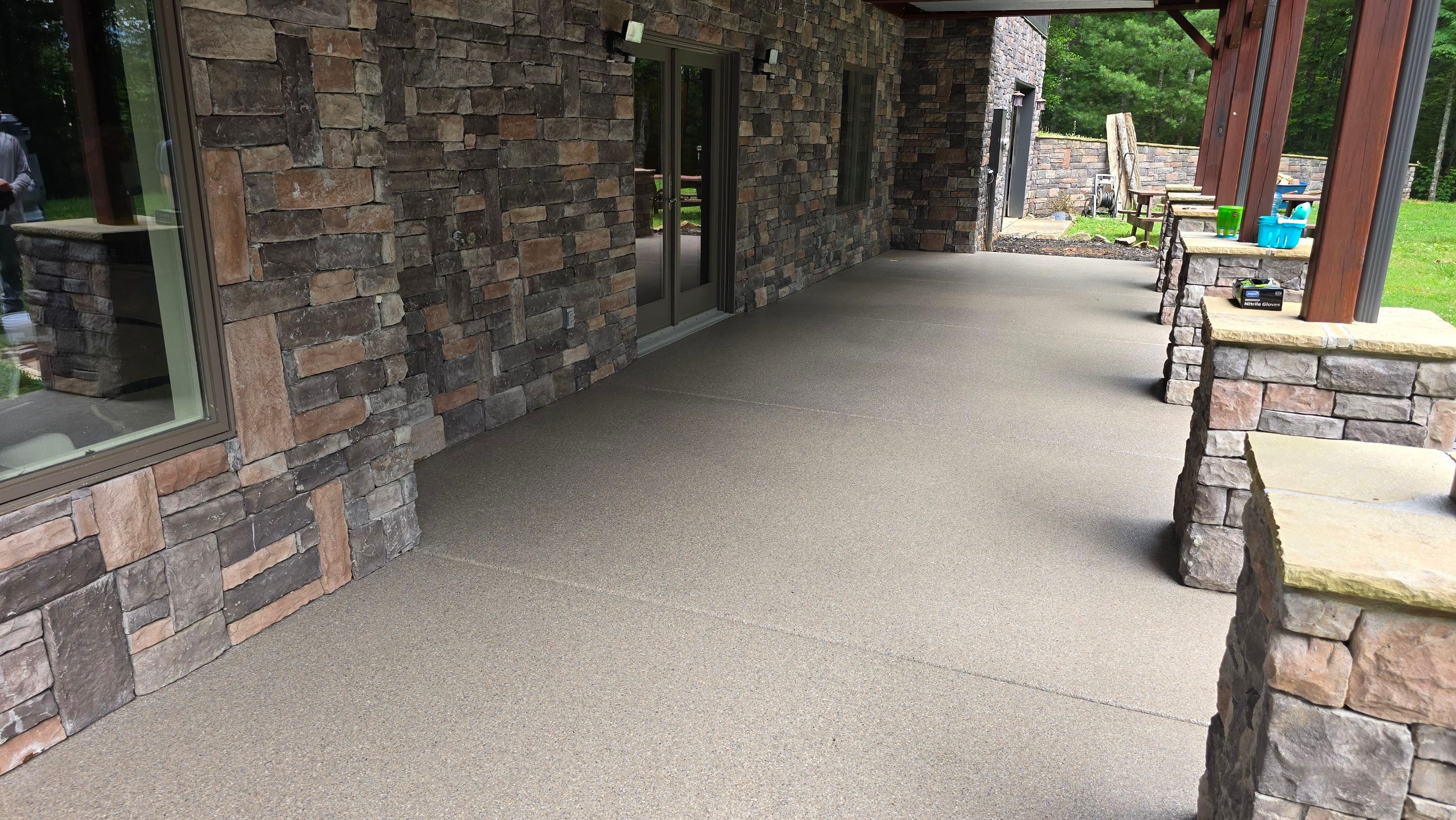 Patio using Obsidian by Elite Floor Solutions