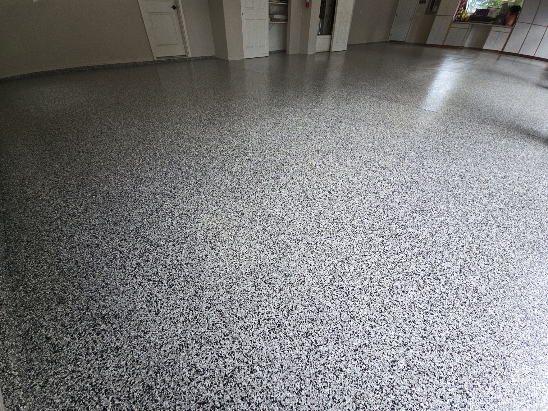 Custom Domino Flake Garage Floor Transformation in Coeur d'Alene by Croc Coatings, LLC