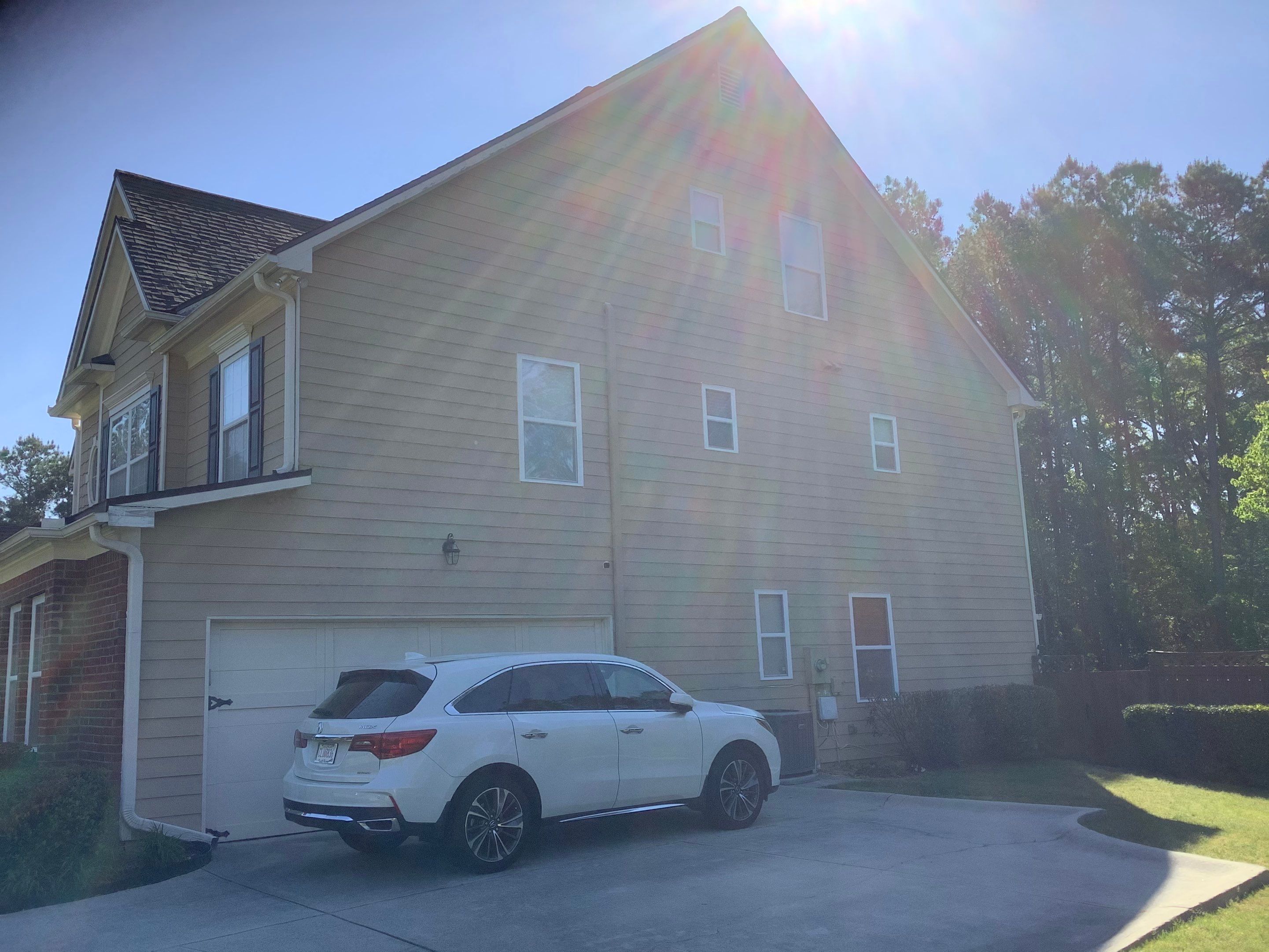 Exterior Home Refresh in Powder Springs with Gray Siding and White Trim by Swift Home Renovations