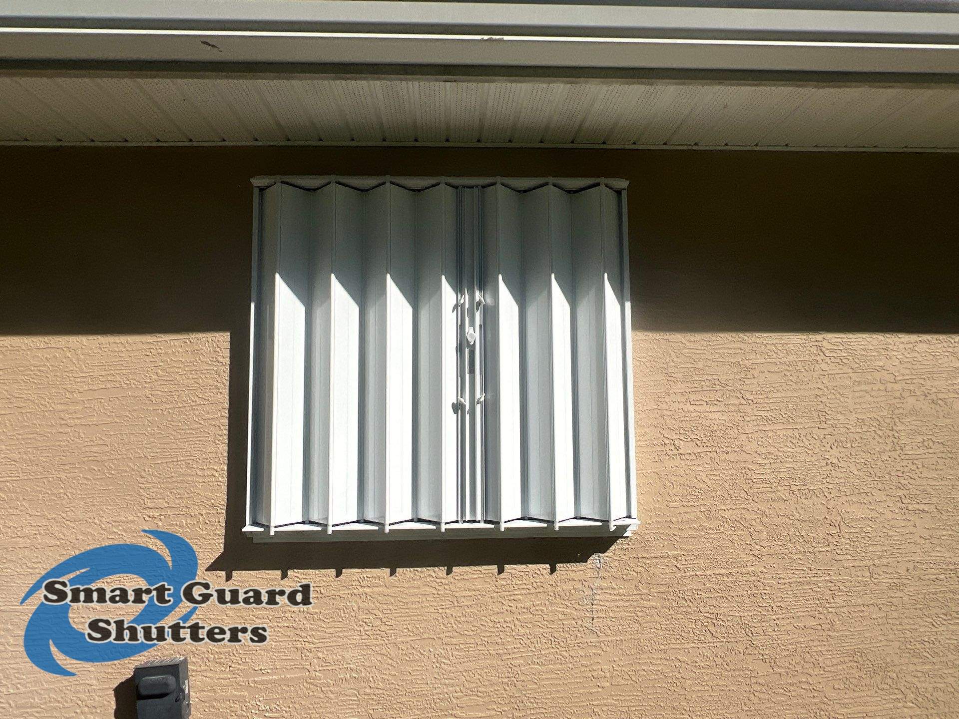 Accordion Shutters in White by Smart Guard Shutters