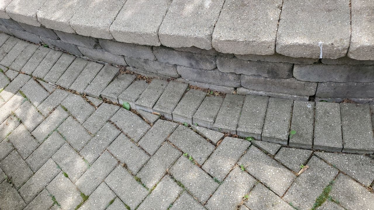 Brick patio repair, clean sand and seal by Northern Power Washing LLC.