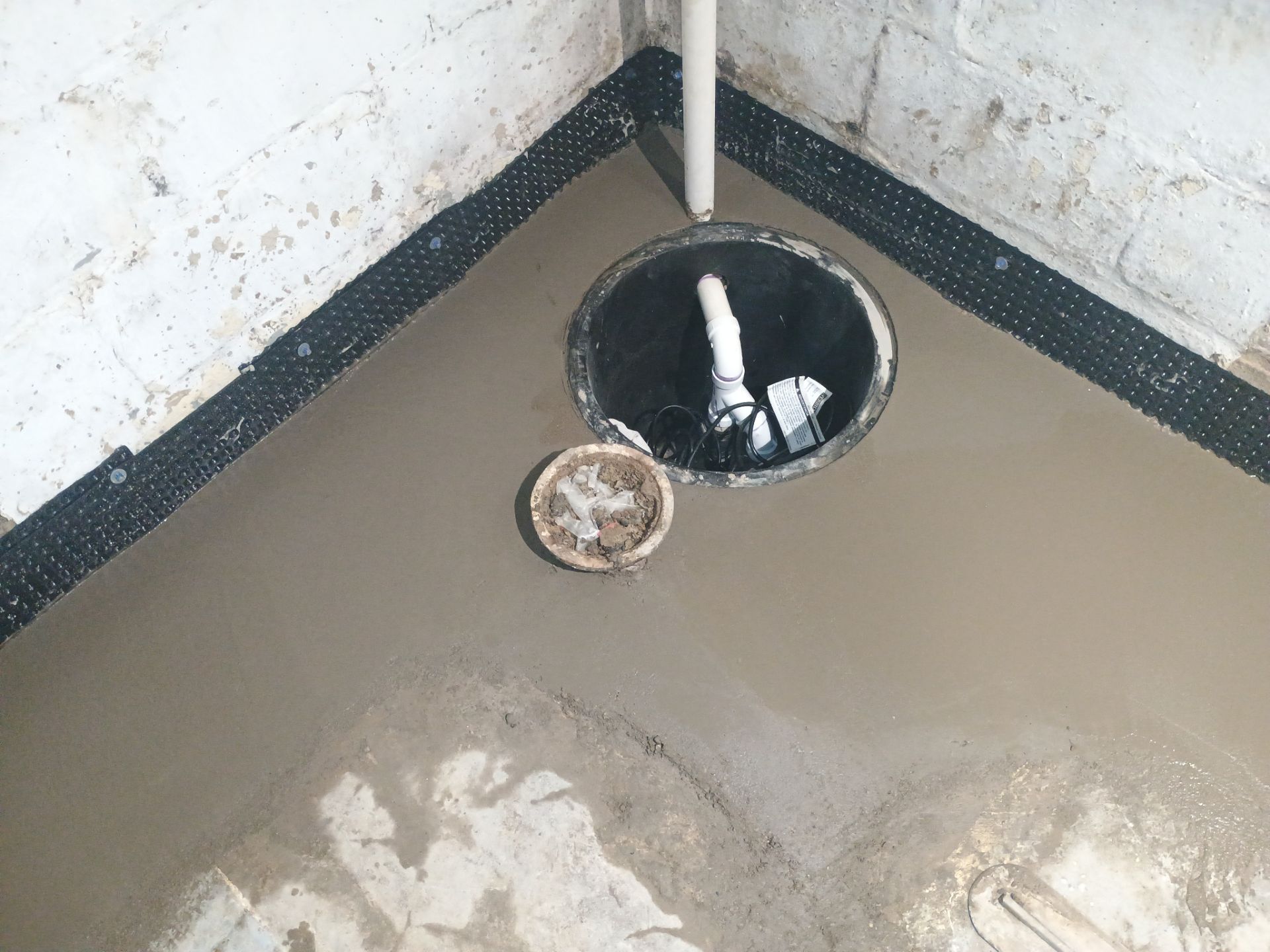 Basement Waterproofing (Drain tile & Sump pump) in North Minneapolis by Waterproofing Northeast