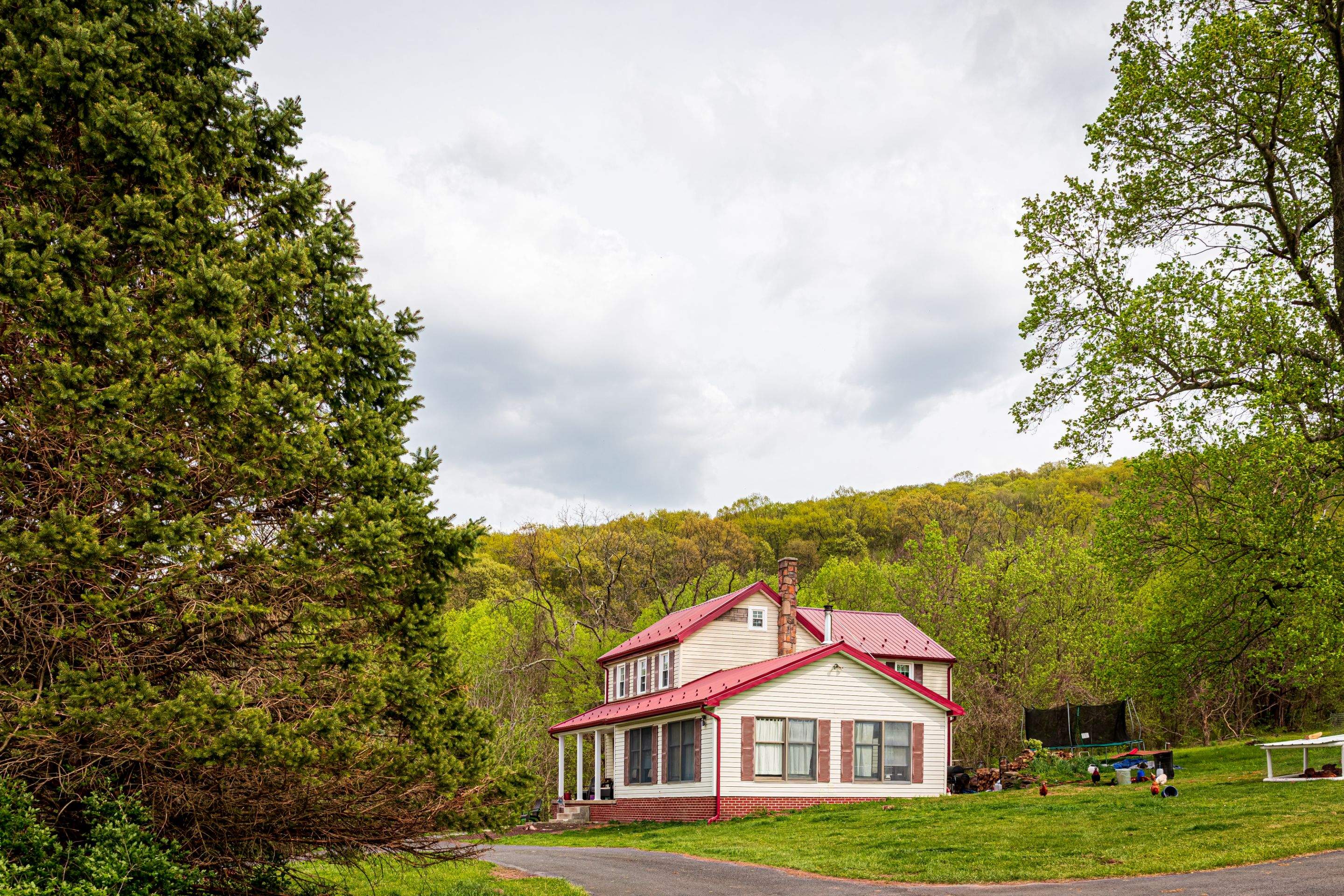 Metal Roof-coloniel red- and new siding by Esh Builders