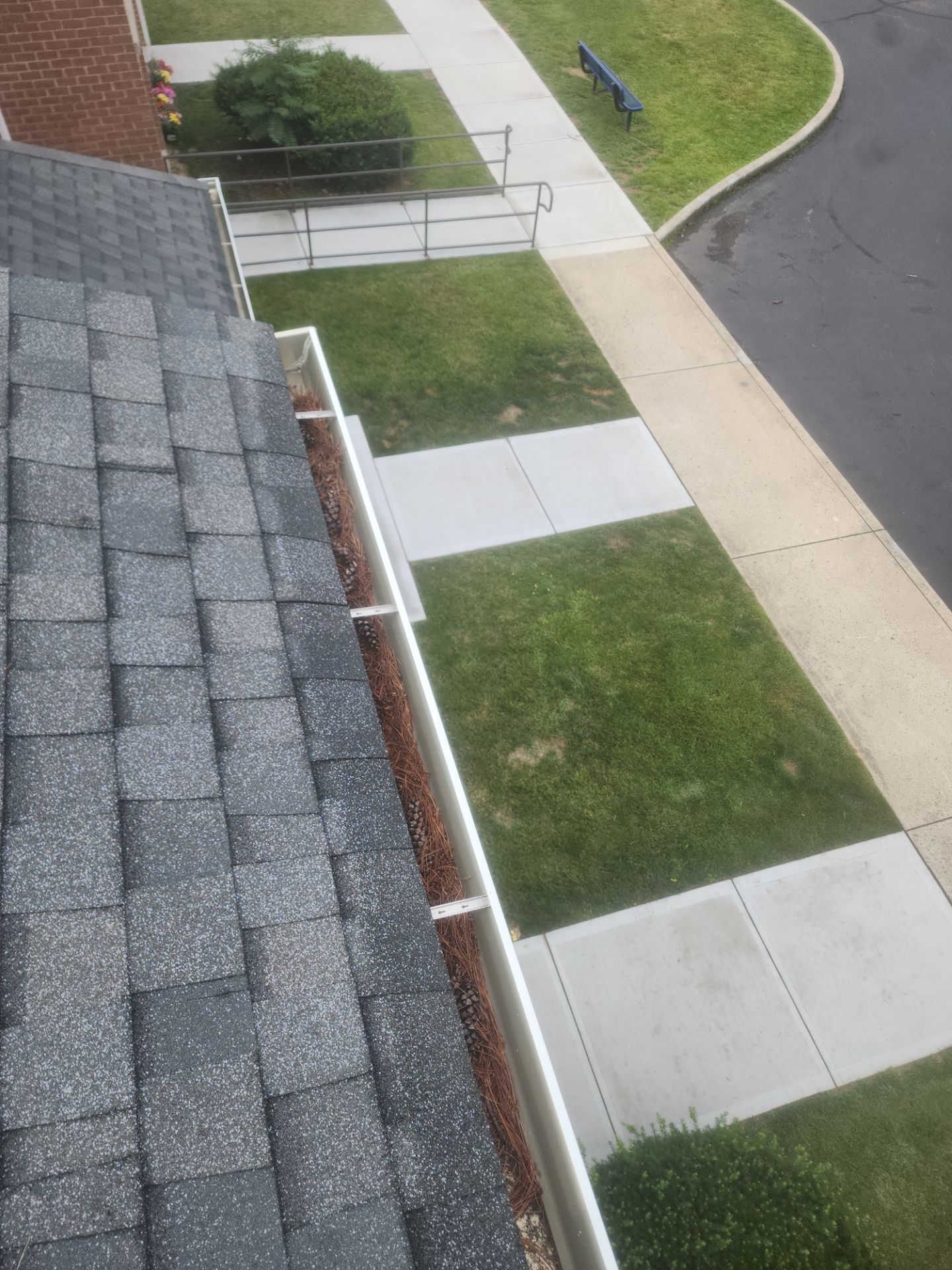 HOA gutter cleaning in Hagerstown, MD,before photo showing full gutters.