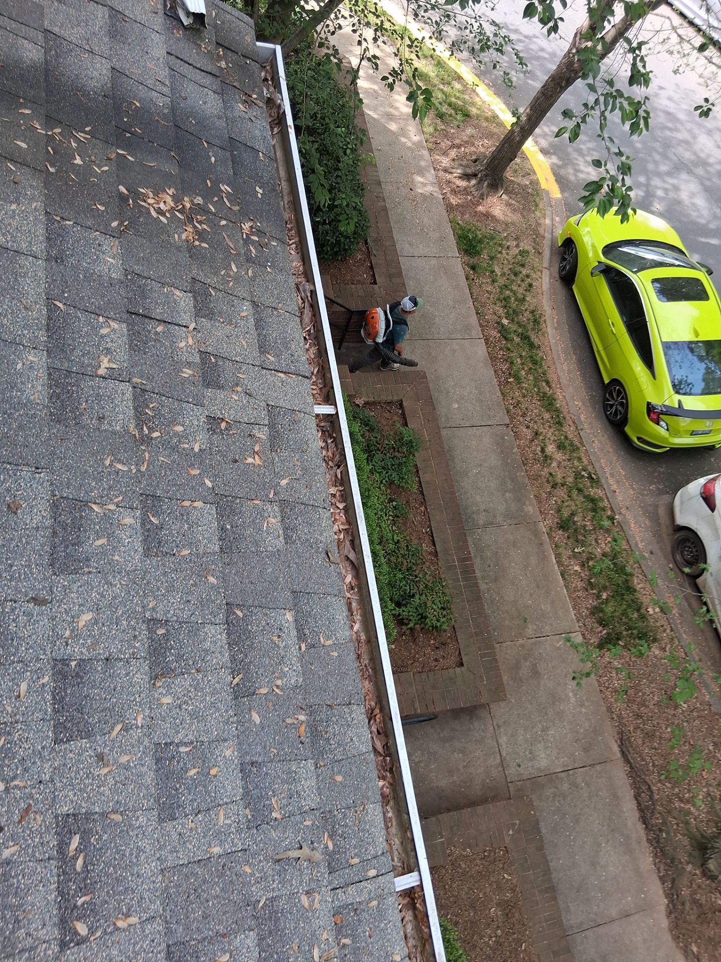 HOA gutter cleaning in Huntersville, NC,before photo showing full gutters.