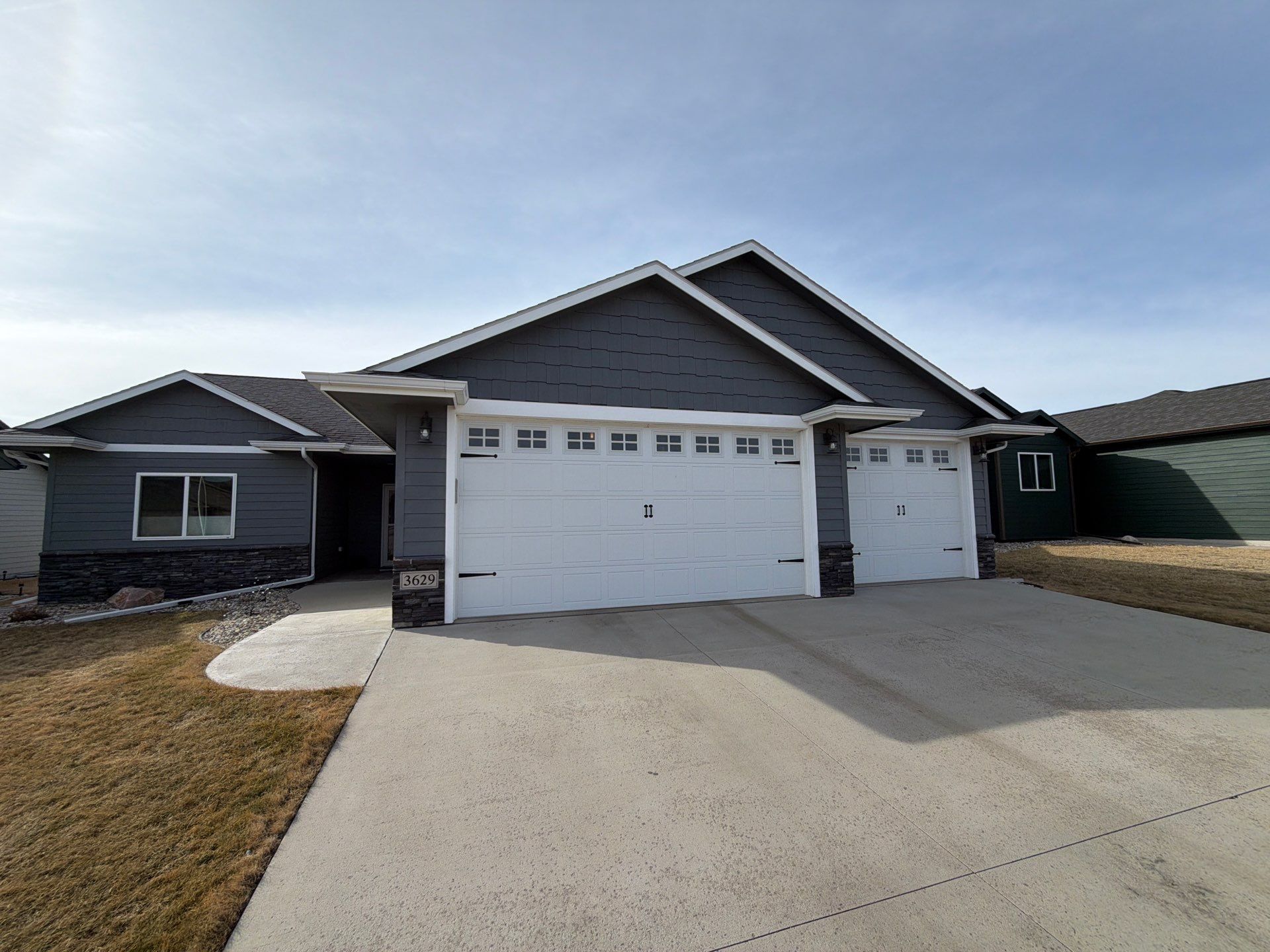 Residential Exterior Painting and Siding Refresh in Sioux Falls by Select Painting, Coatings & Garage Cabinets