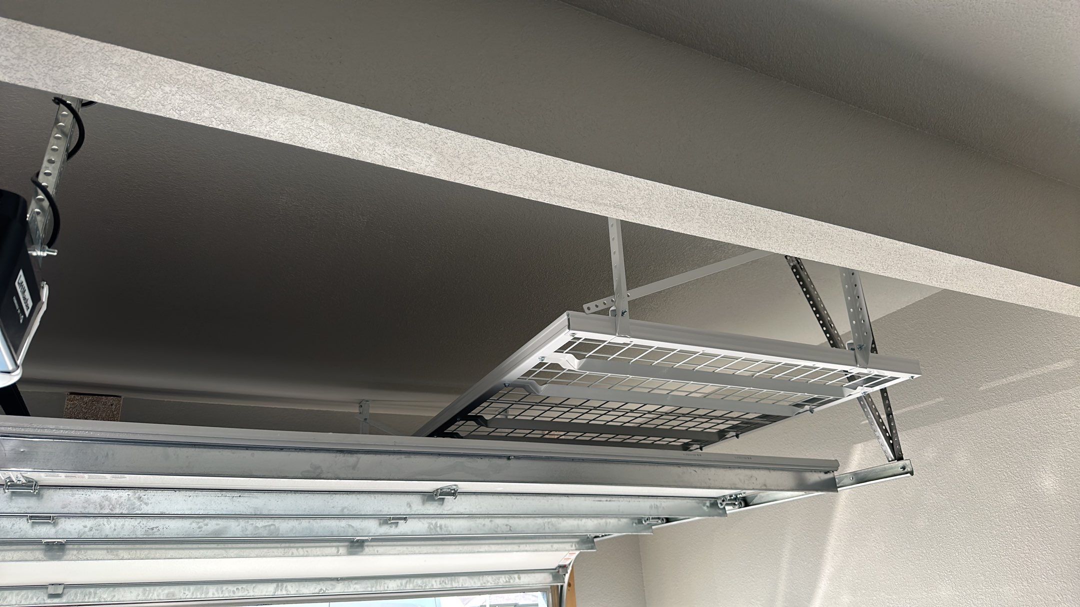 John H. maximized his storage with overhead racks and wall shelves by Banner Garage