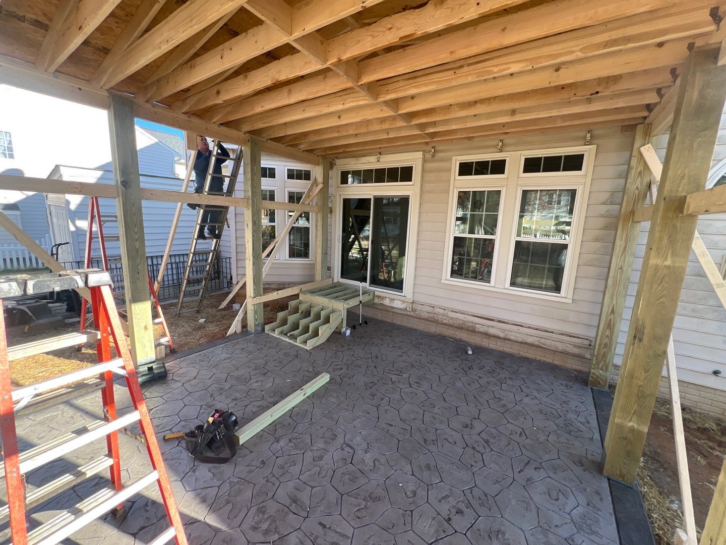 Custom Screened-In Porch with Stamped Concrete Patio in Warrenton by Jakari Restoration & Construction LLC