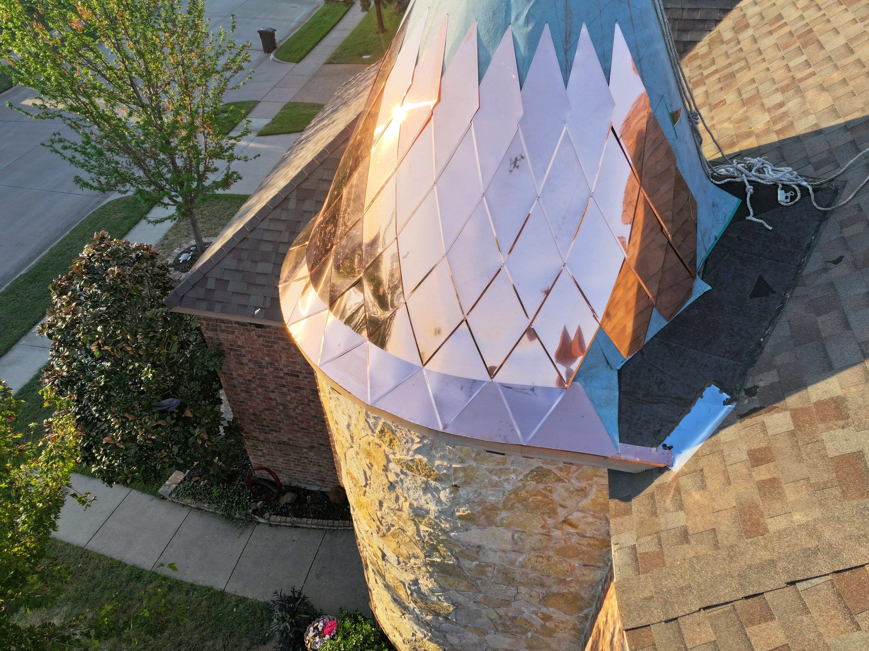 Installing Custom copper turret and Malarkey Vista Class 4 shingles Hail Damage Upgrade by Becker Roofing and Exteriors