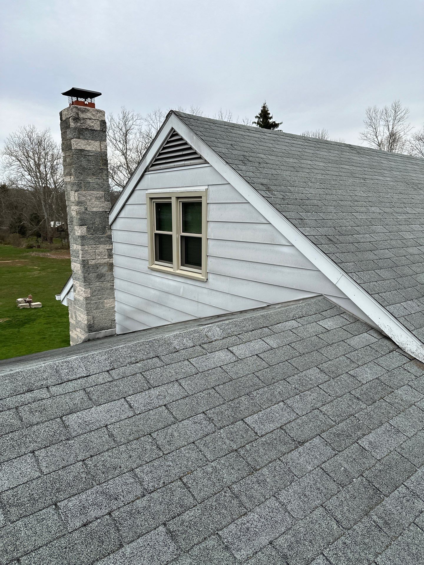 Metal Roofing, Board & Batten Siding, and Entry Door Transformation by Esh Builders