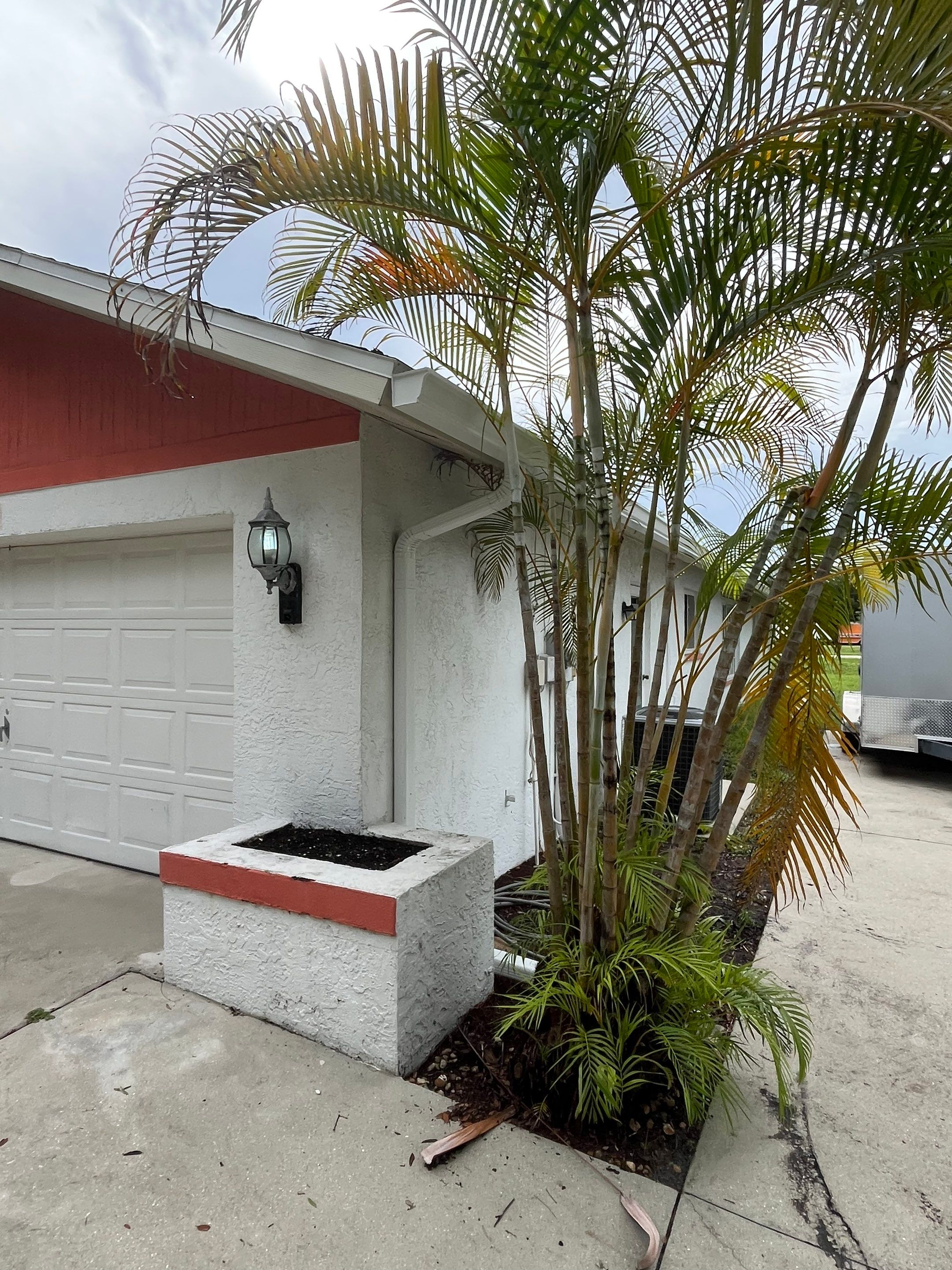 White Seamless Gutters with Splash Guards in North Fort Myers FL by Gutter Professor   by Gutter Professors