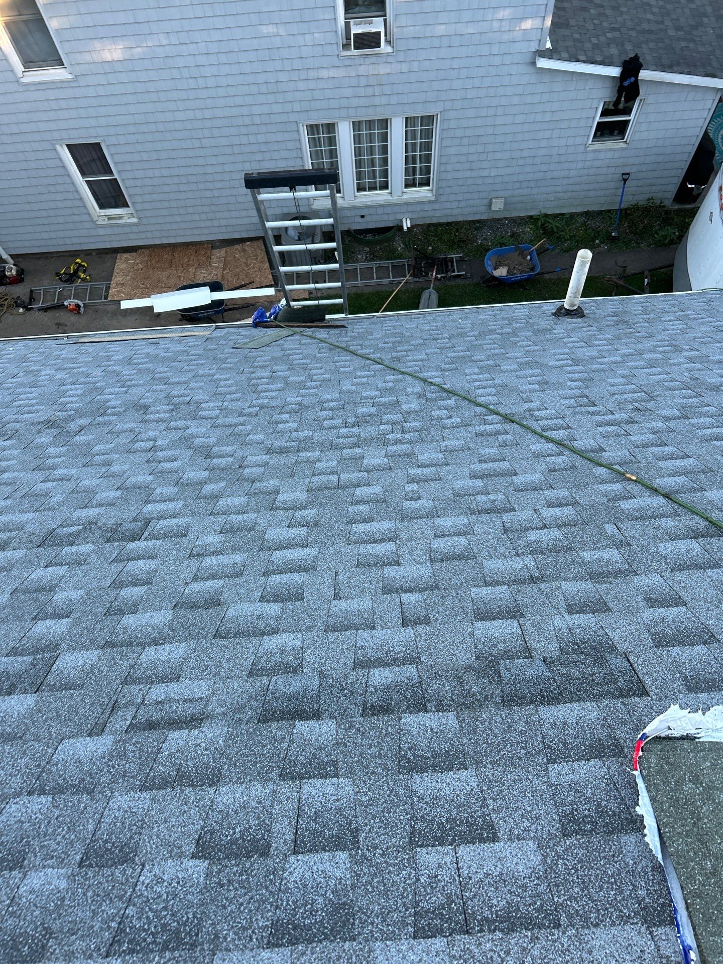 Residential Roofing Installation using GAF Timberline HDZ Oyster Grey by Rainstoppers Roofing