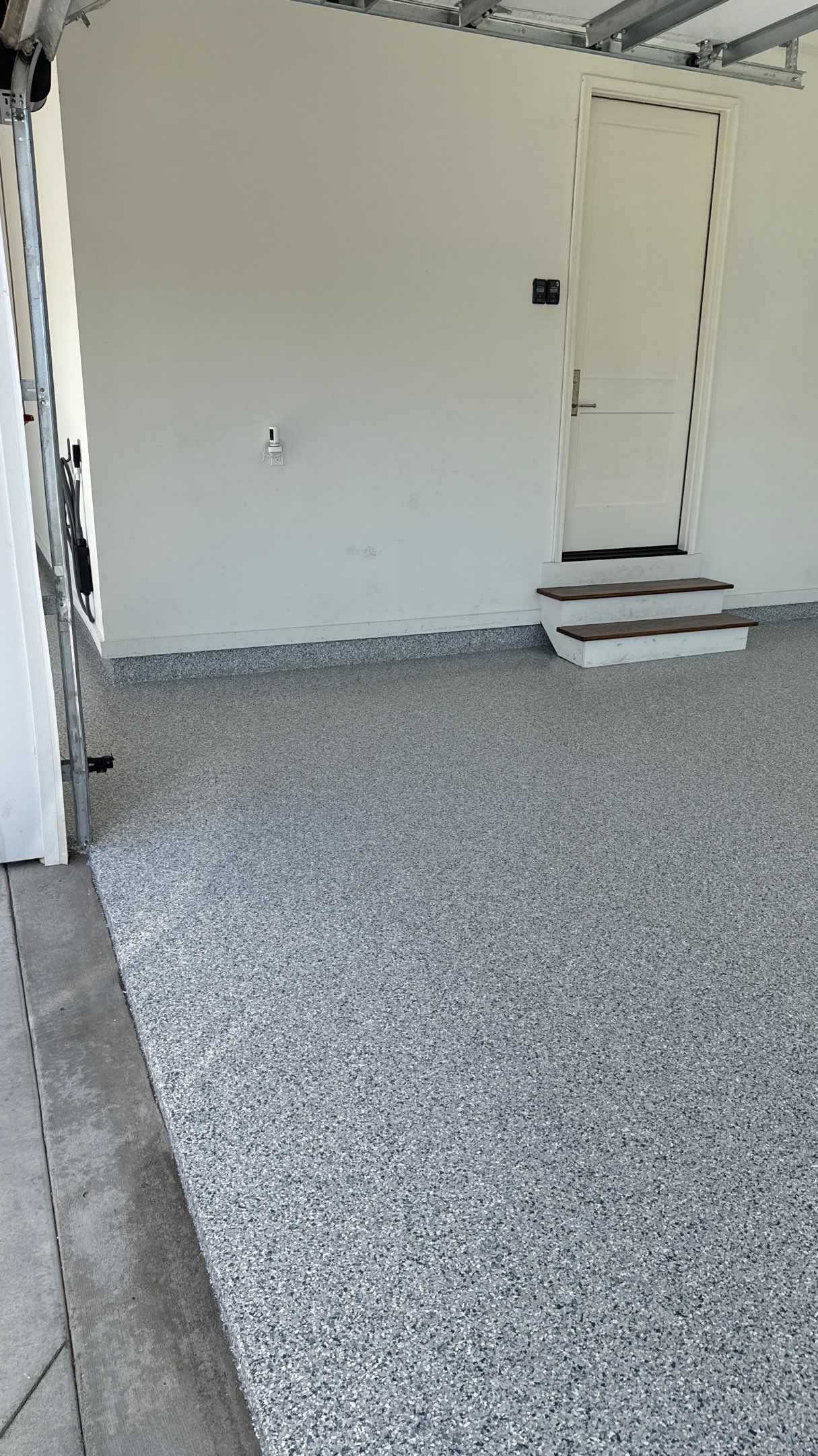 Garage Remodel with Custom Cabinets and Epoxy Floors in Overland Park by Banner Garage