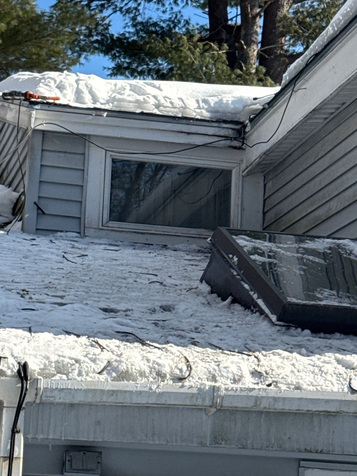 Ice Dam Removal, Snow Removal & Sidewall Flashing Repair in Acton, MA by Mighty Dog Roofing of Greater Middlesex County