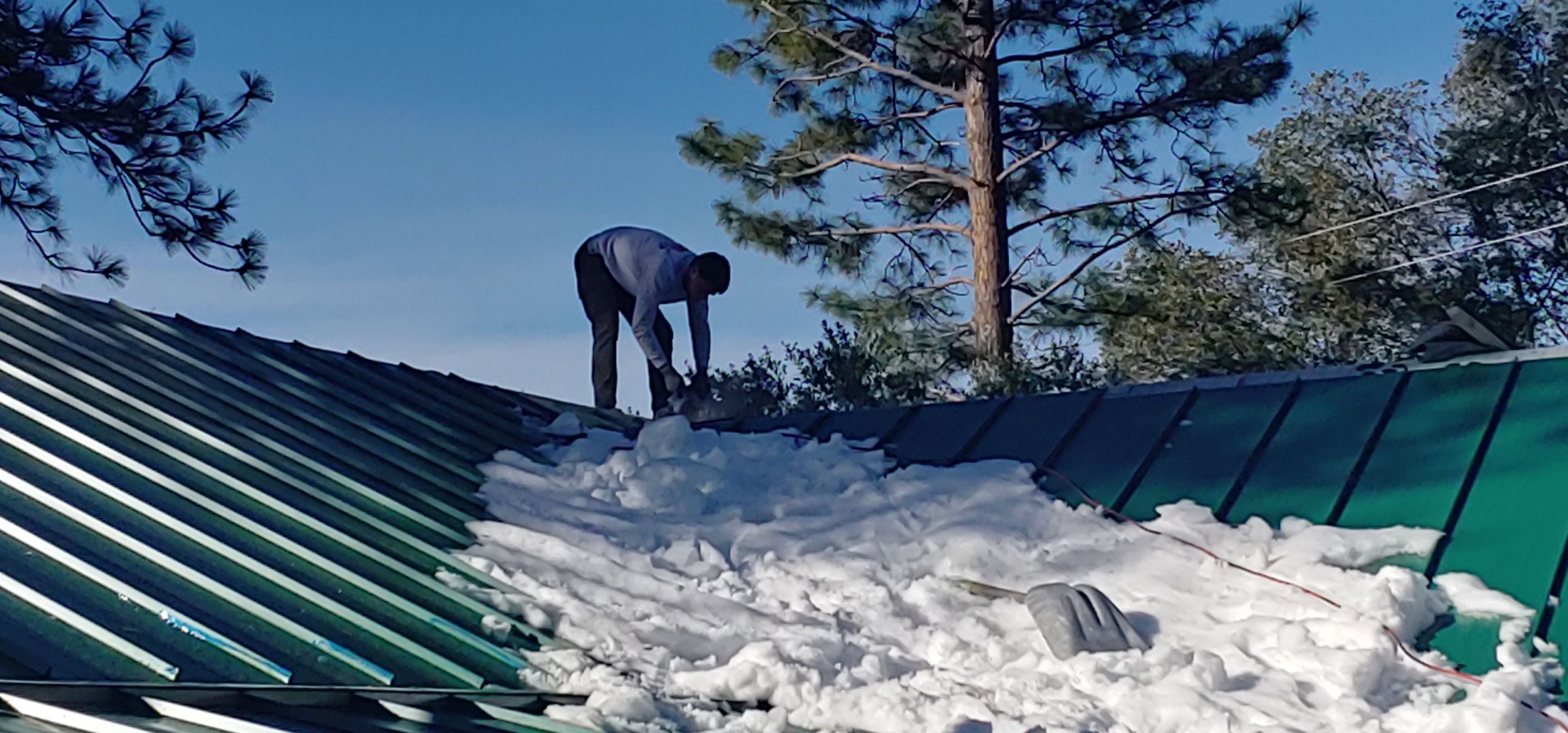 Metal roofing installation using Standing seam metal roofing system by Straight Edge Roofing Inc