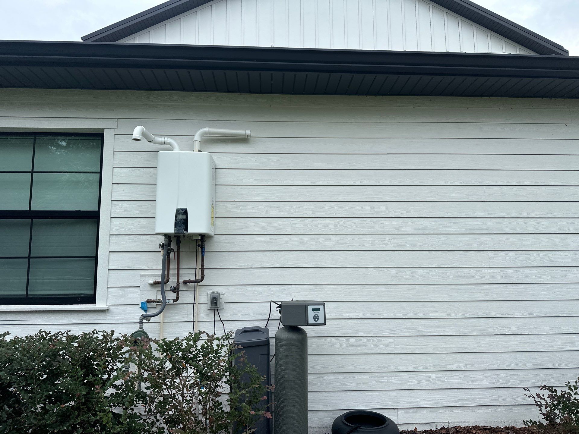 Complete Two-Story House Wash and Driveway Cleaning in Winding River Community, Bradenton, FL by Sunshine AquaWash
