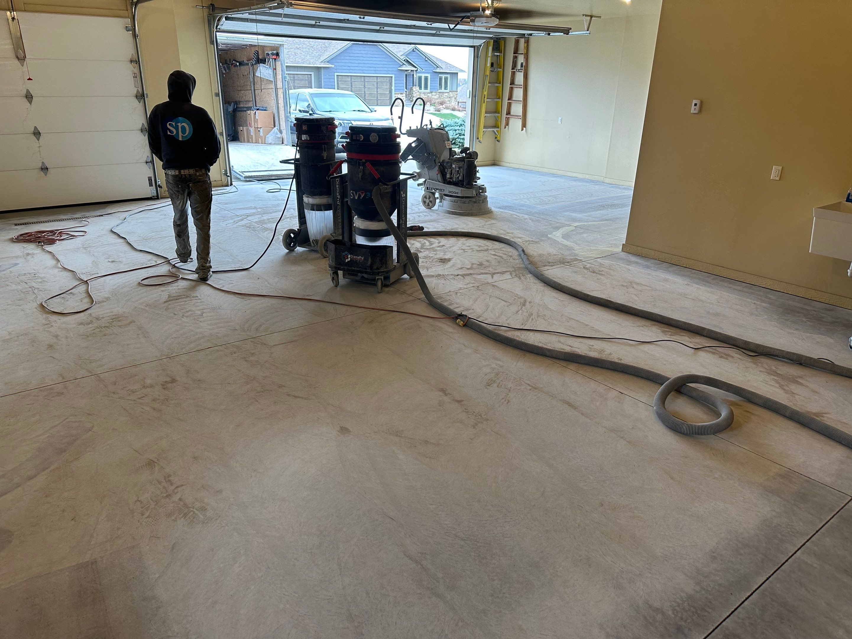 Sioux Falls Garage Floor Concrete Coating with Shoreline Flake Finish by Select Painting, Coatings & Garage Cabinets
