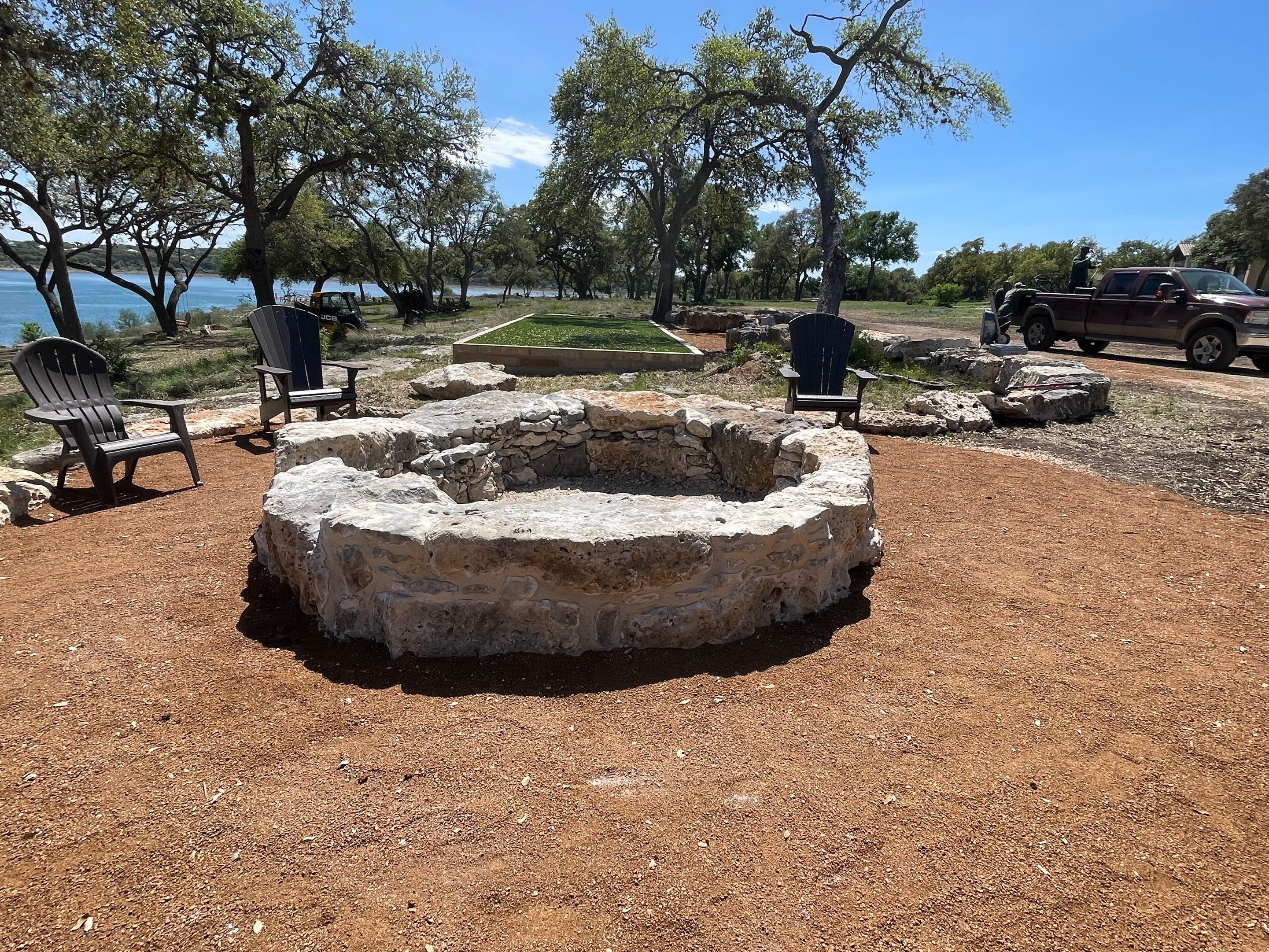 Lakeside Firepit and Turf Area by Singer Services