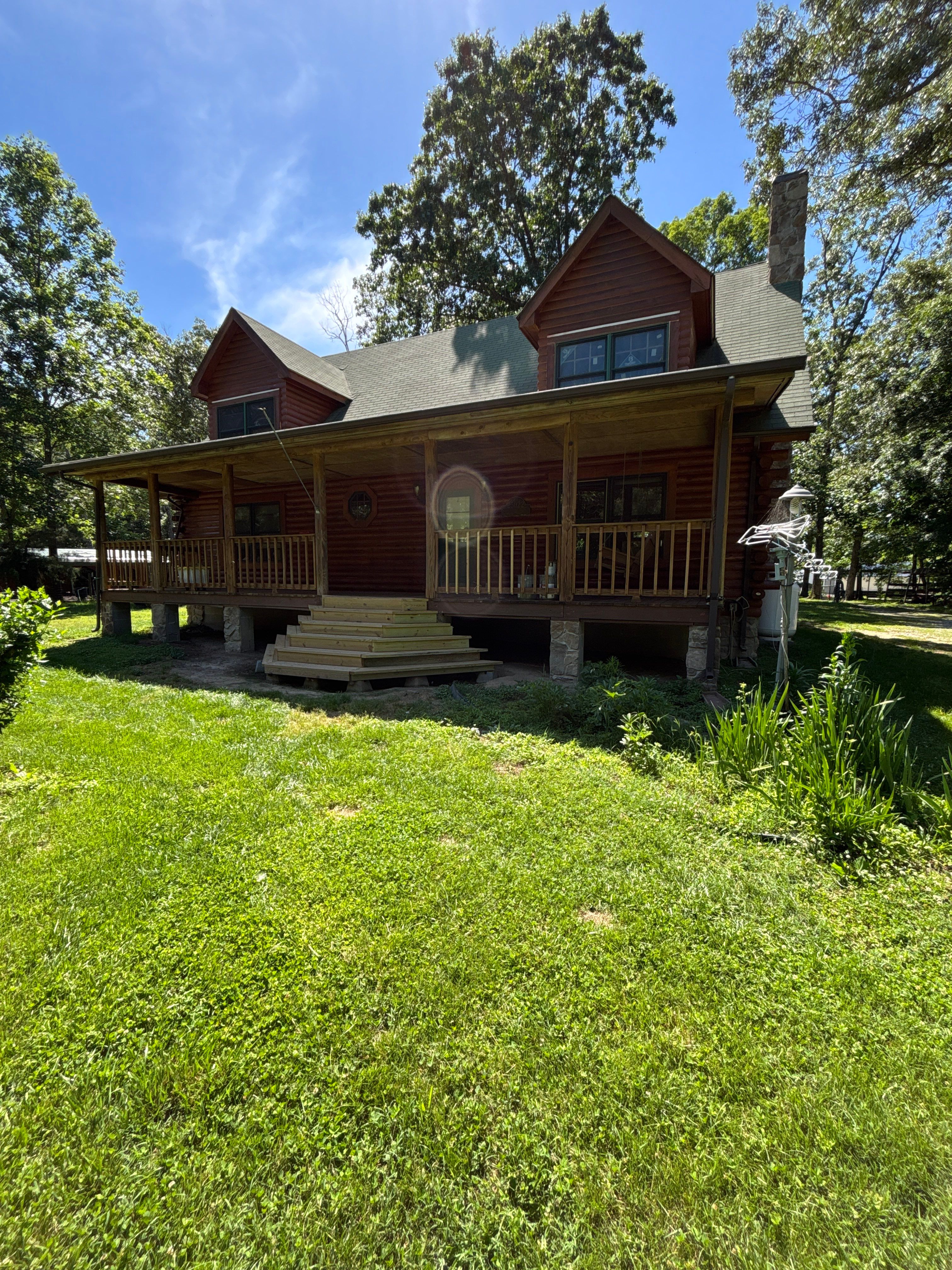 Jay's Log Cabin Re-Stain by Highfill Painting