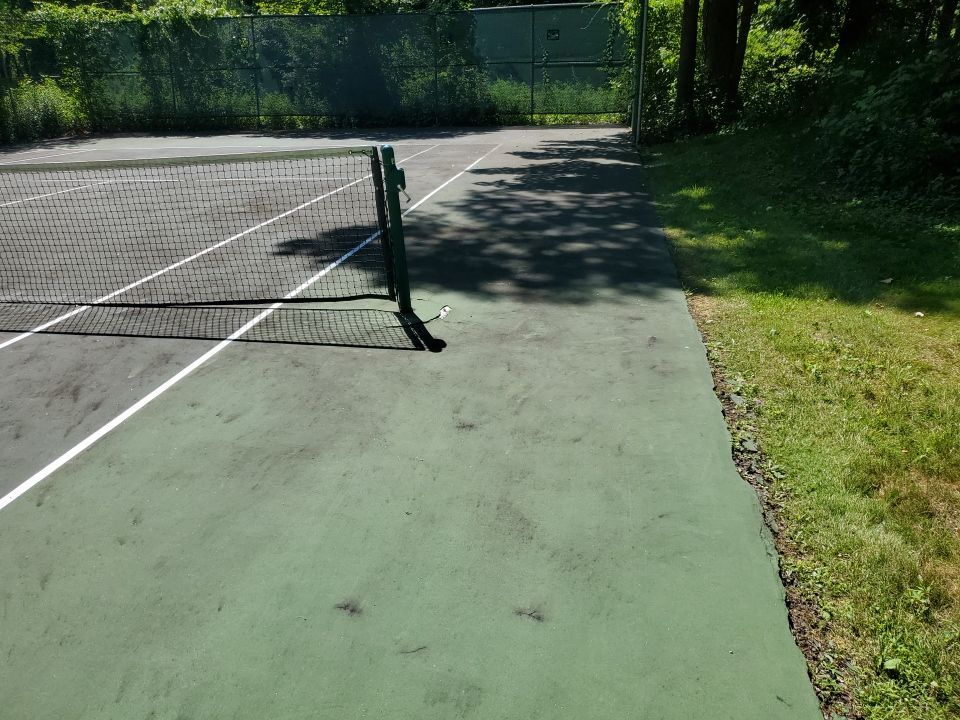 Deck, Patio, and Tennis Court Cleaning by Northern Power Washing LLC.