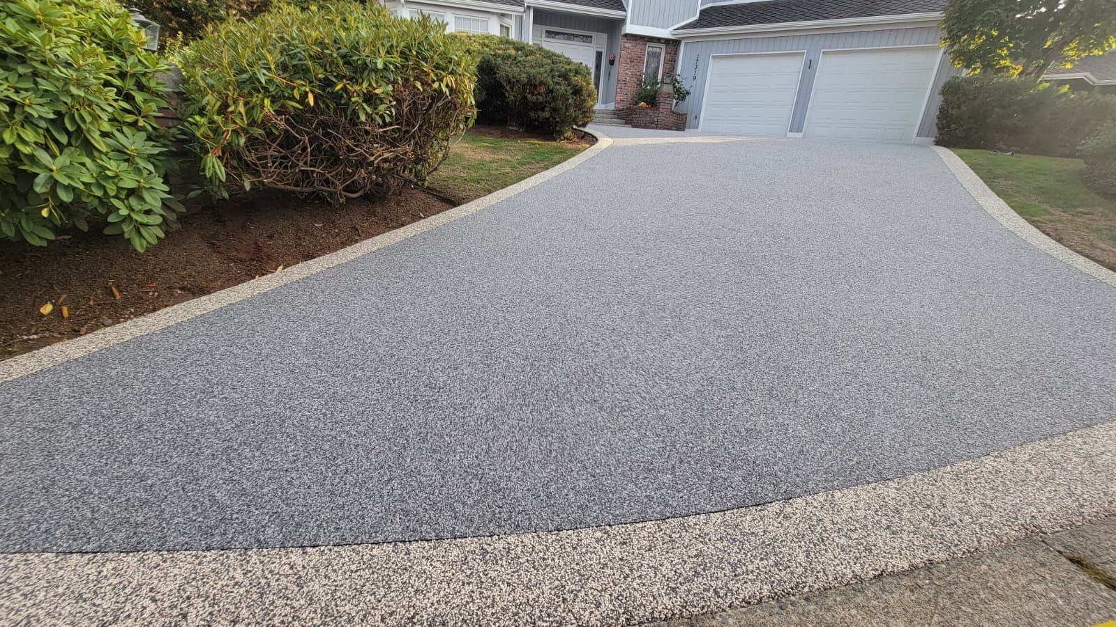 Elegant Driveway and Patio in Palazzo Vuba Stone by Concrete Coating Experts Inc.