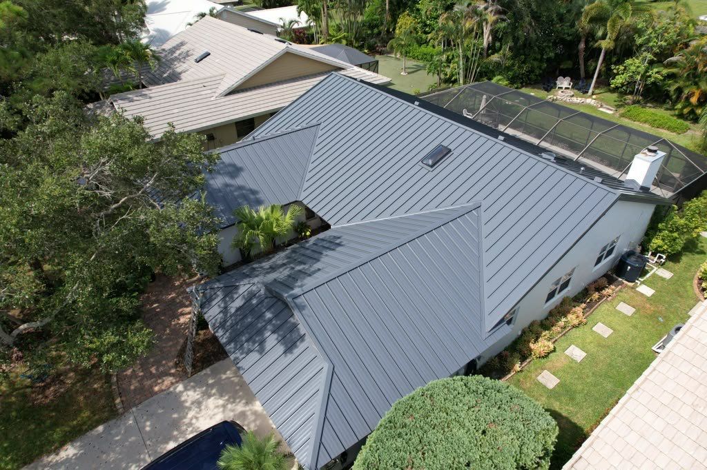 Standing Seam Metal Charcoal Grey Roof Replacement and Skylight Installation in Jupiter by Art's Roofing & Construction