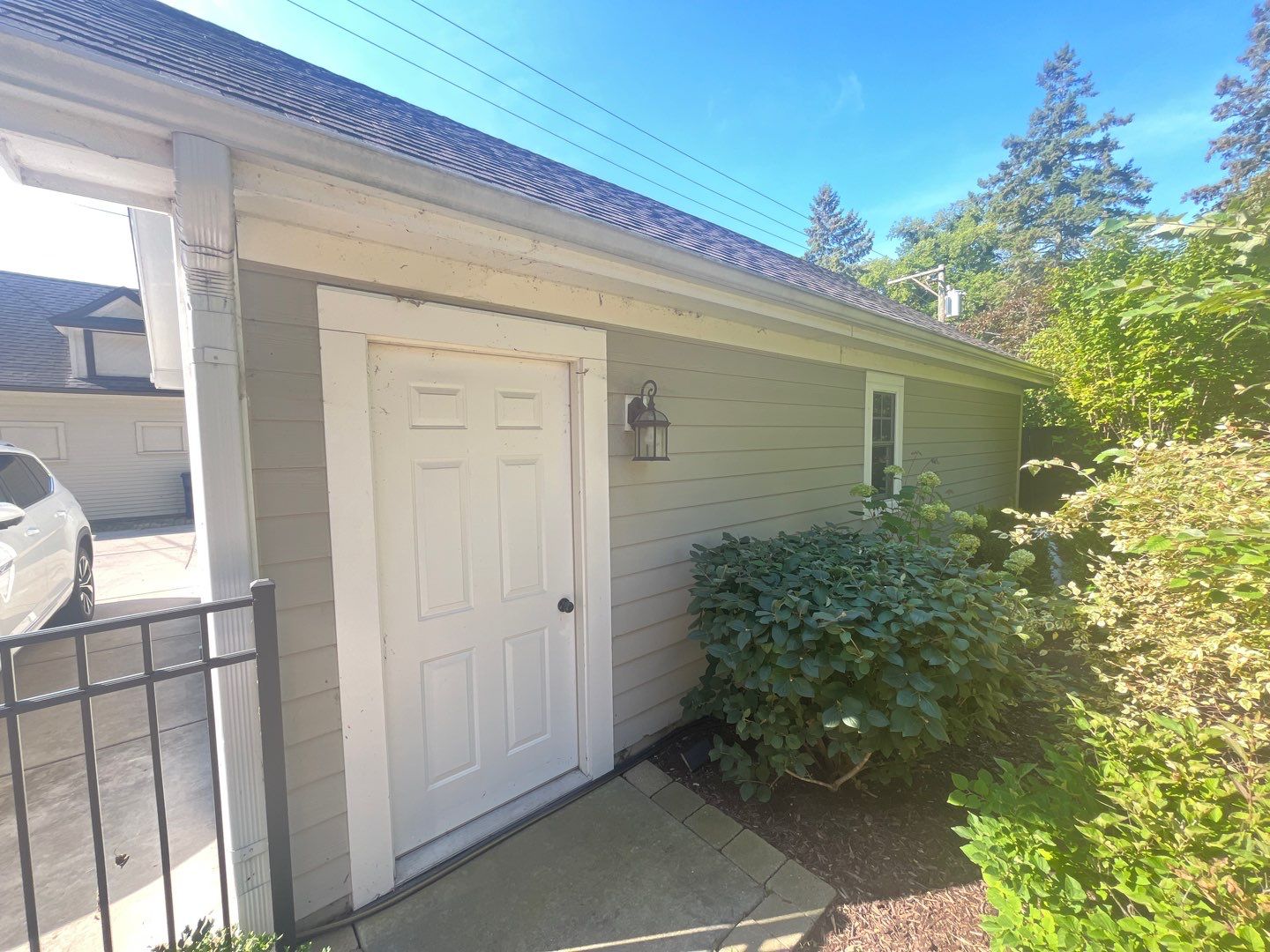 Hardie Board House & Detached Garage Soft Washing by Northern Power Washing LLC.