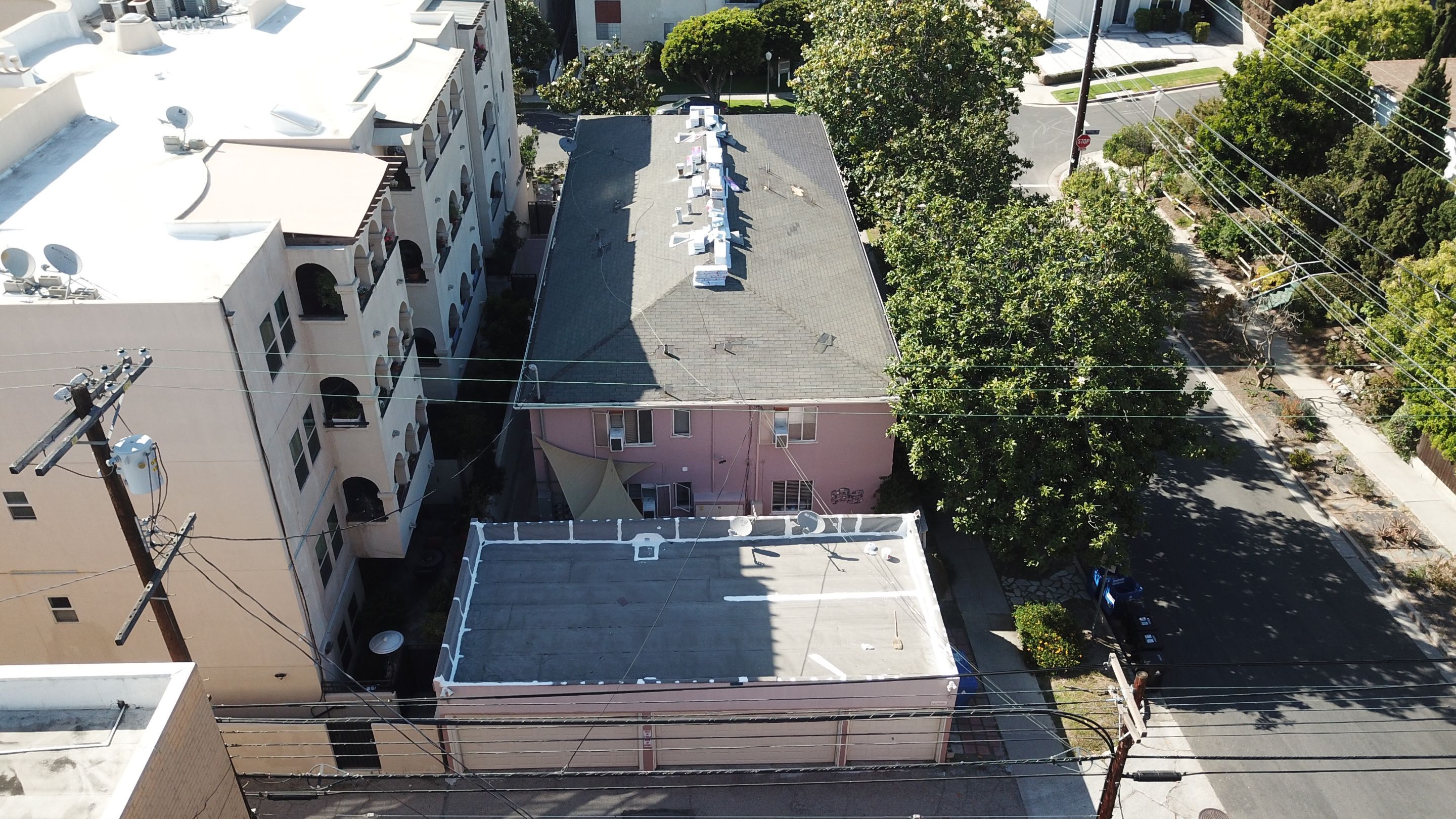 Apartment Building 2nd Layer Installation &Silicone coating by Hull Brothers Roofing