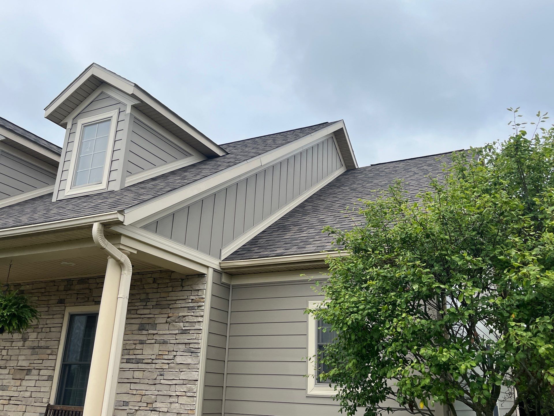 Siding Installation using Alside Ascend Board and Batten Pebblestone Clay by Nitro Roofing and Construction