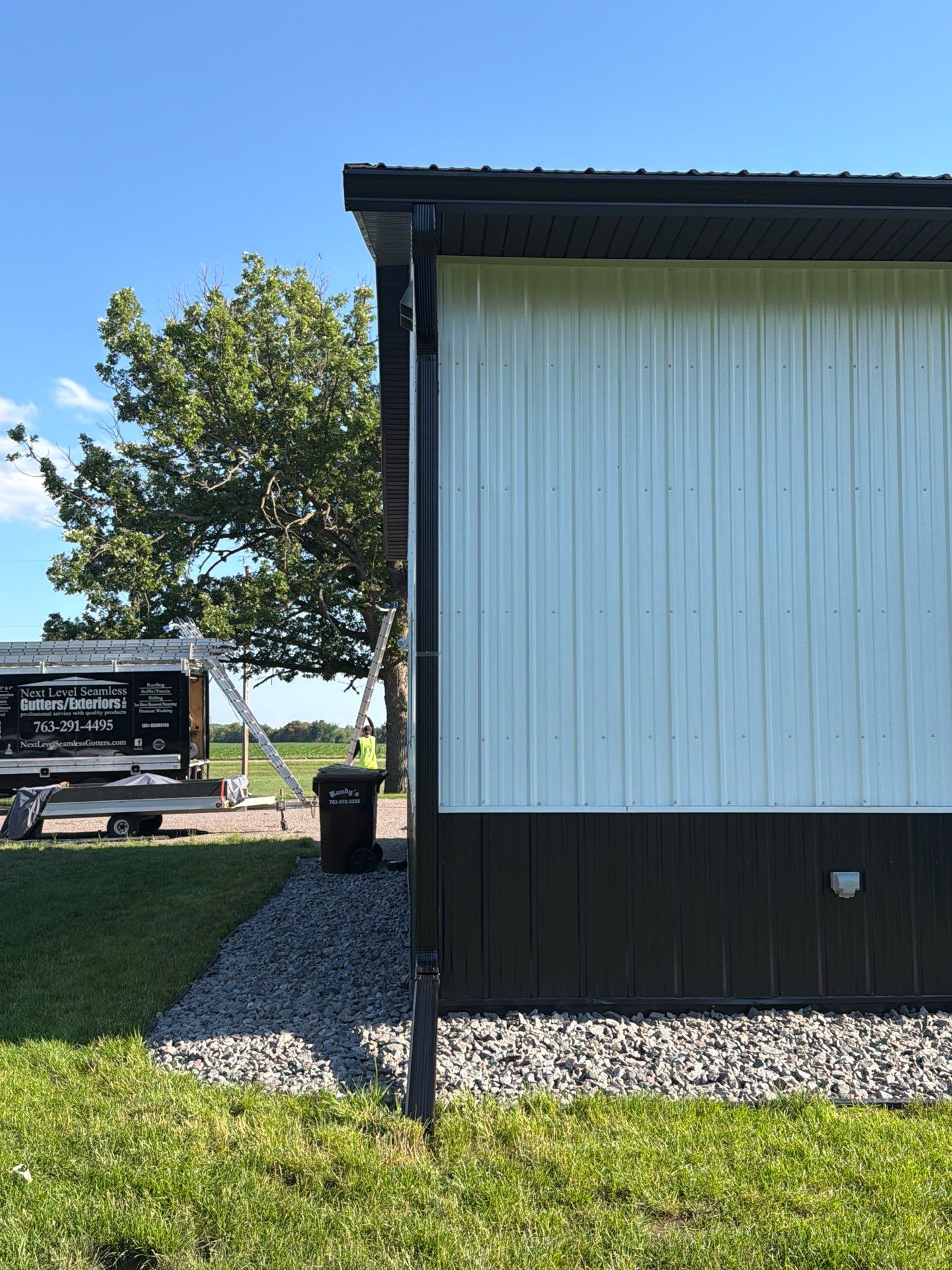 Black Seamless Gutter Installation for barndominium in Buffalo by Next Level Seamless Gutters / Exteriors Inc.
