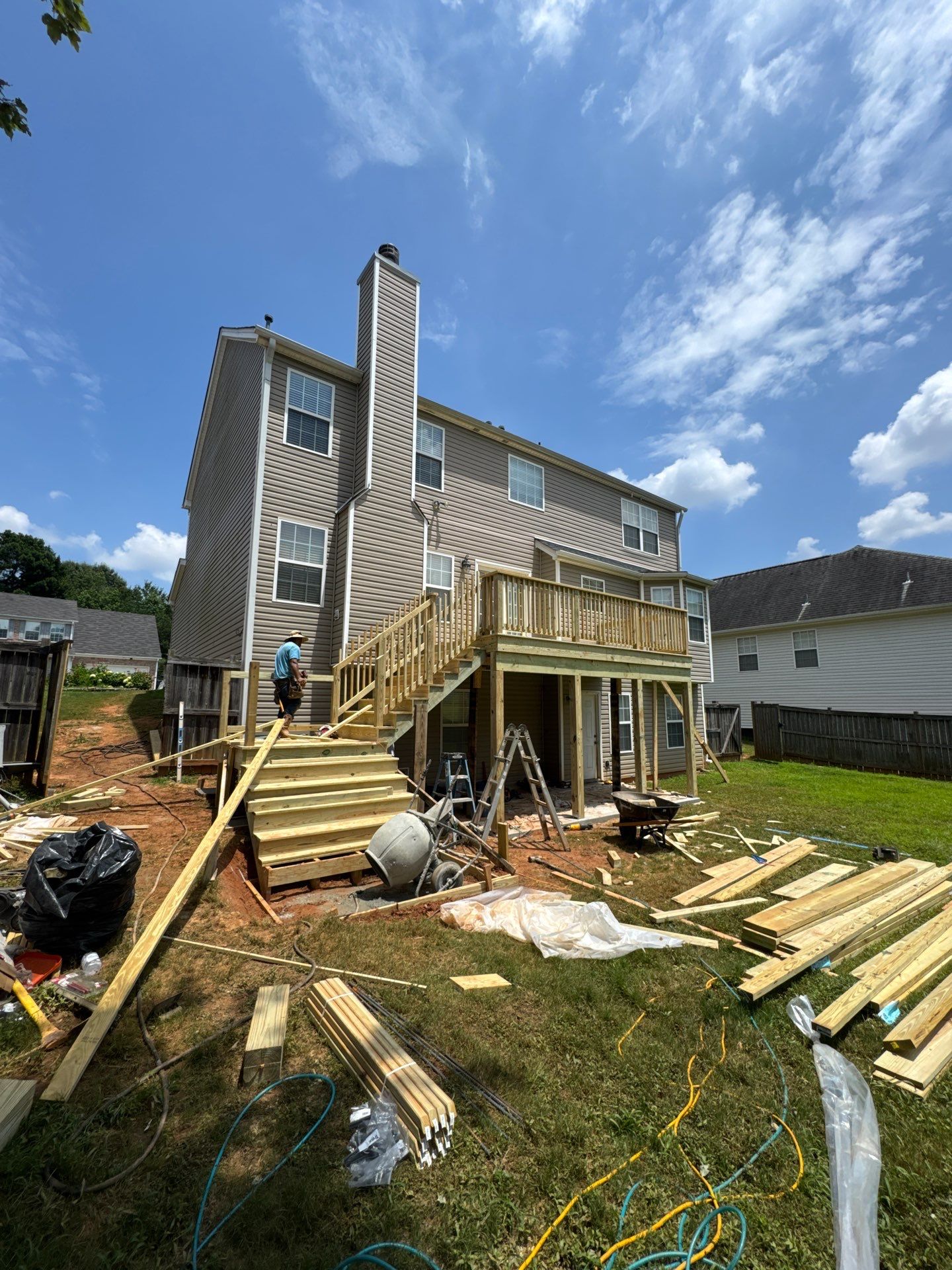 Backyard Deck Expansion & Custom Staircase Installation in Suwanee. by Swift Home Renovations