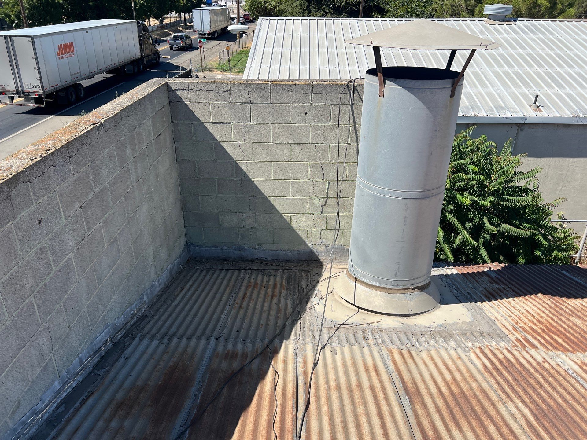 Spray foam and coatings using Conklin Benchmark/ PUMA XL acrylic coatings over metal and foam by Straight Edge Roofing Inc