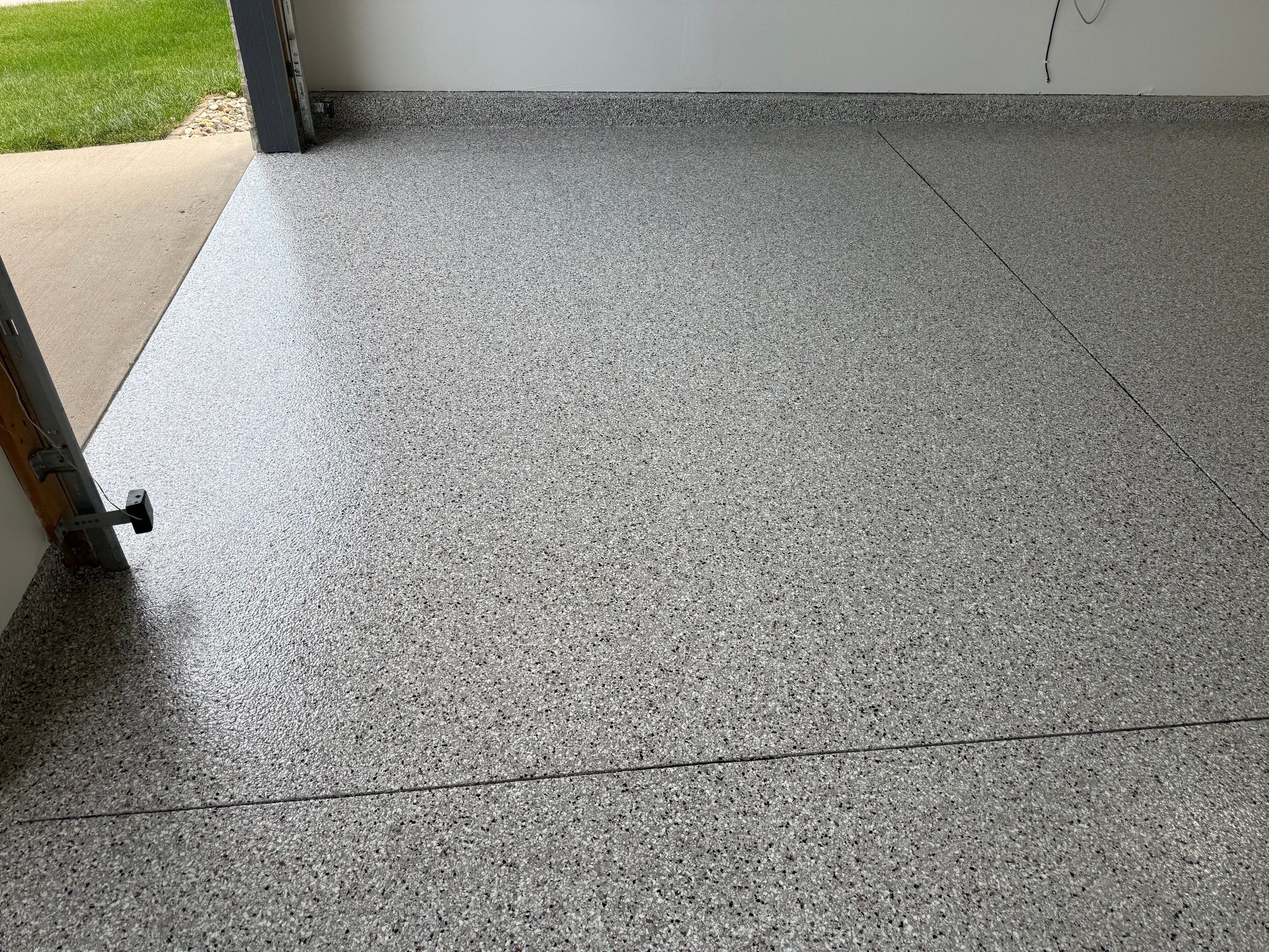 Full Garage Floor Resurfacing and Decorative Epoxy Flake Finish by Select Painting, Coatings & Garage Cabinets