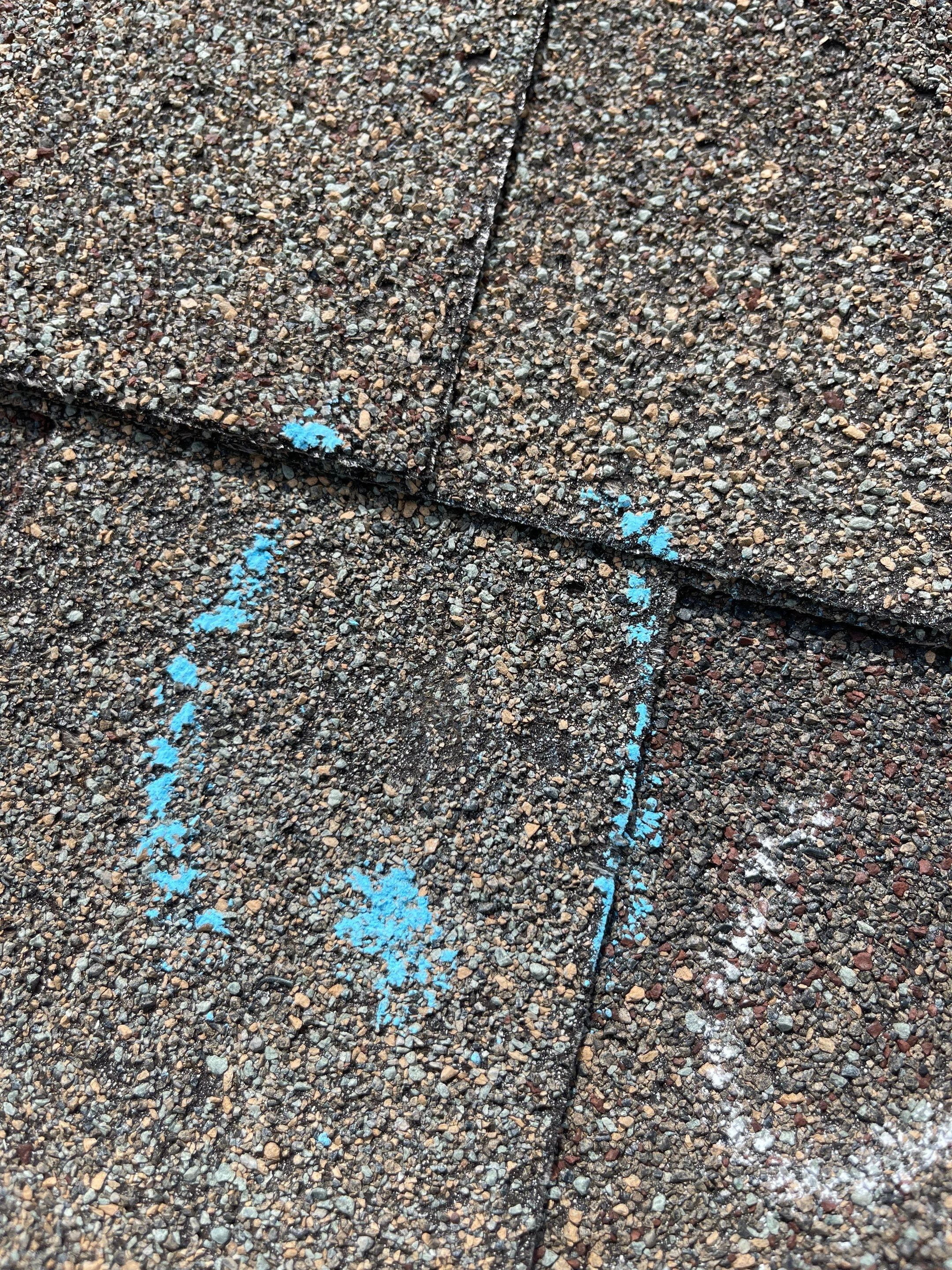 Hail Damage on a Roofing System by Icon Roofing And Construction 