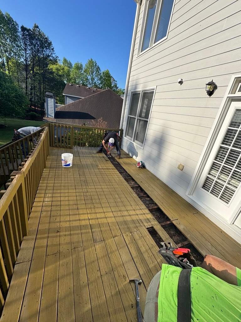 Kennesaw Deck Renovation Featuring Pressure-Treated Lumber and Metal Railings by Swift Home Renovations
