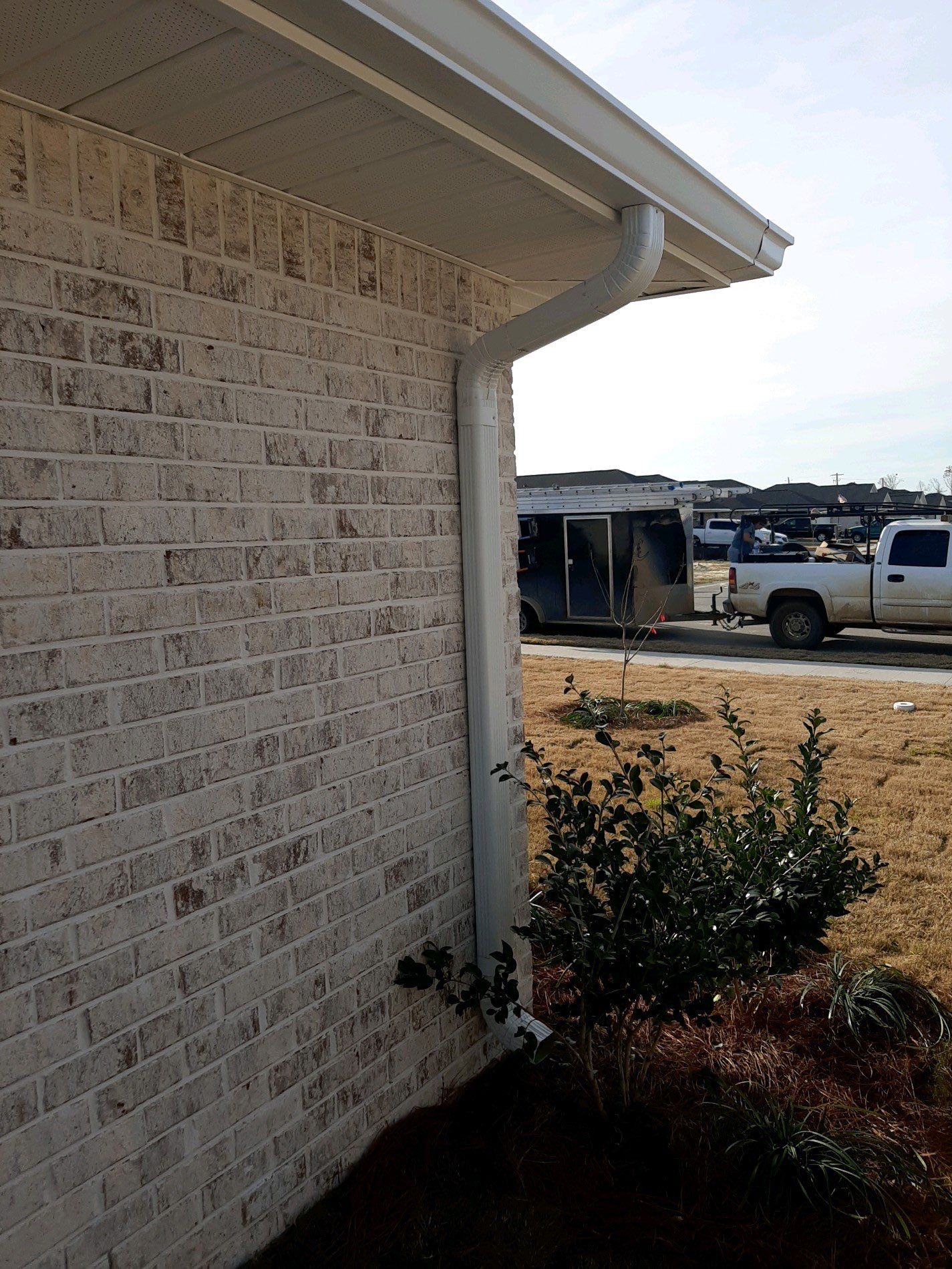 Seamless Gutter Installation Using White K-Style Gutters by Gutter Professors